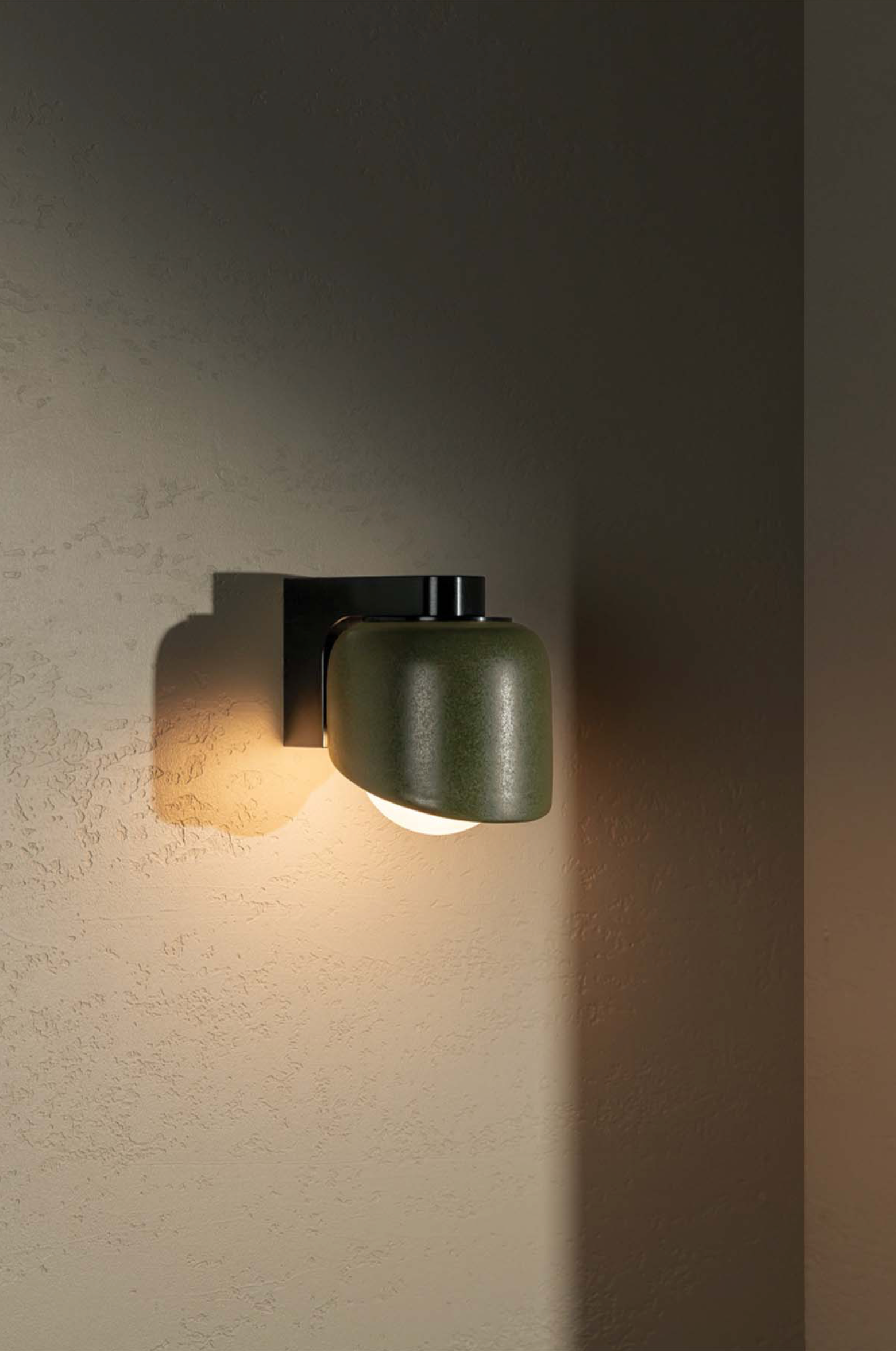 Wall-mounted light fixture on a textured wall