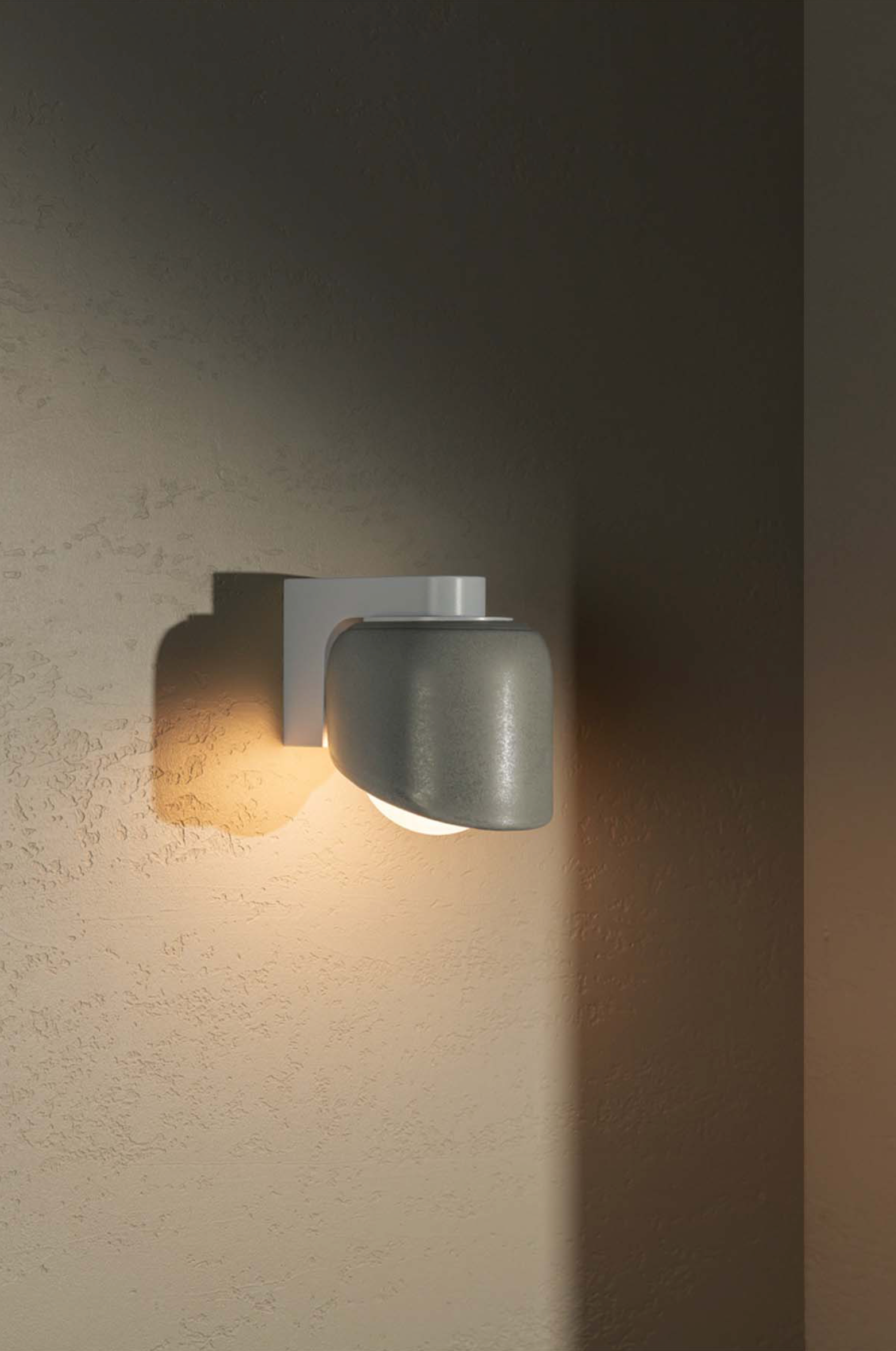 Wall-mounted light fixture on a textured wall
