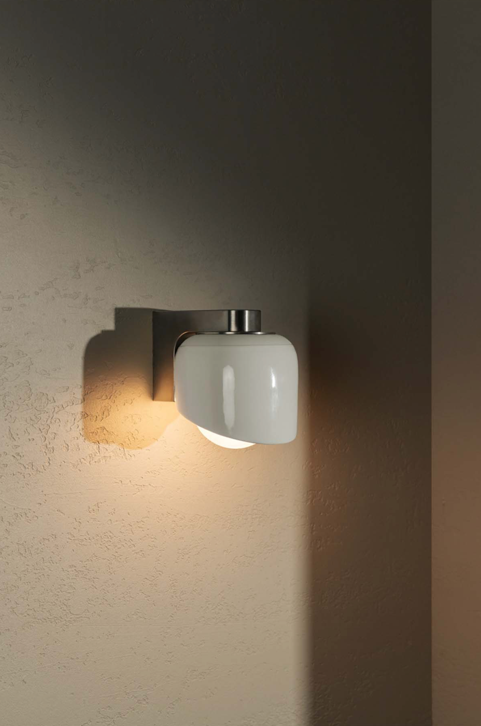 Wall-mounted light fixture on a textured wall
