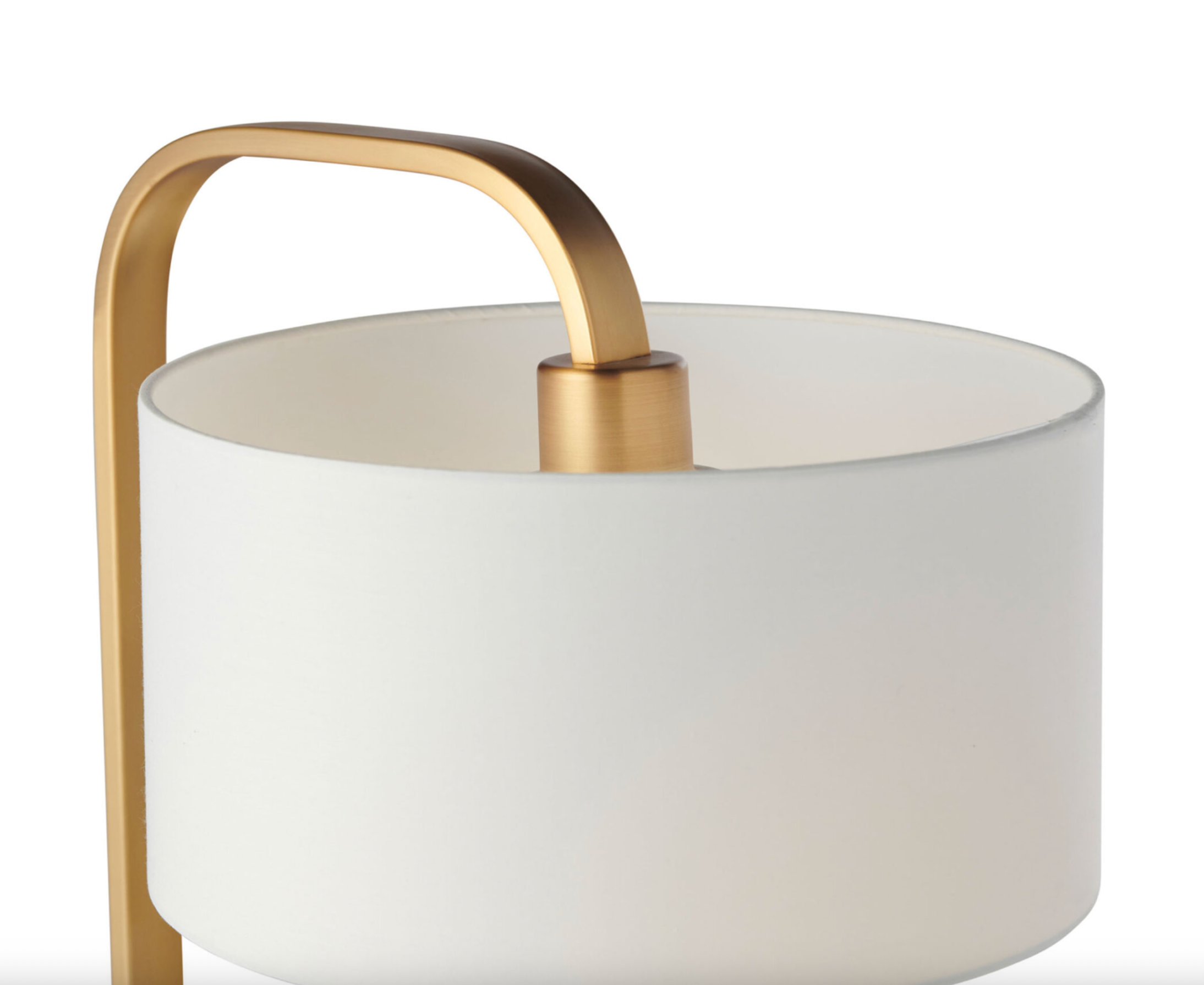 White lamp with gold handle on a white background