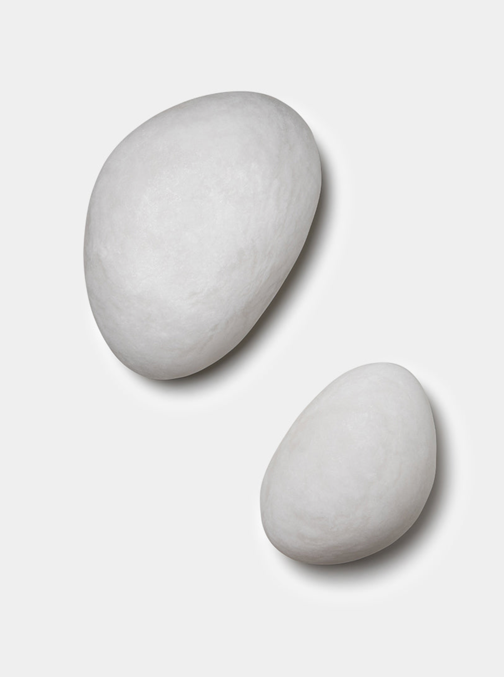 Two textured wall lights on a white background