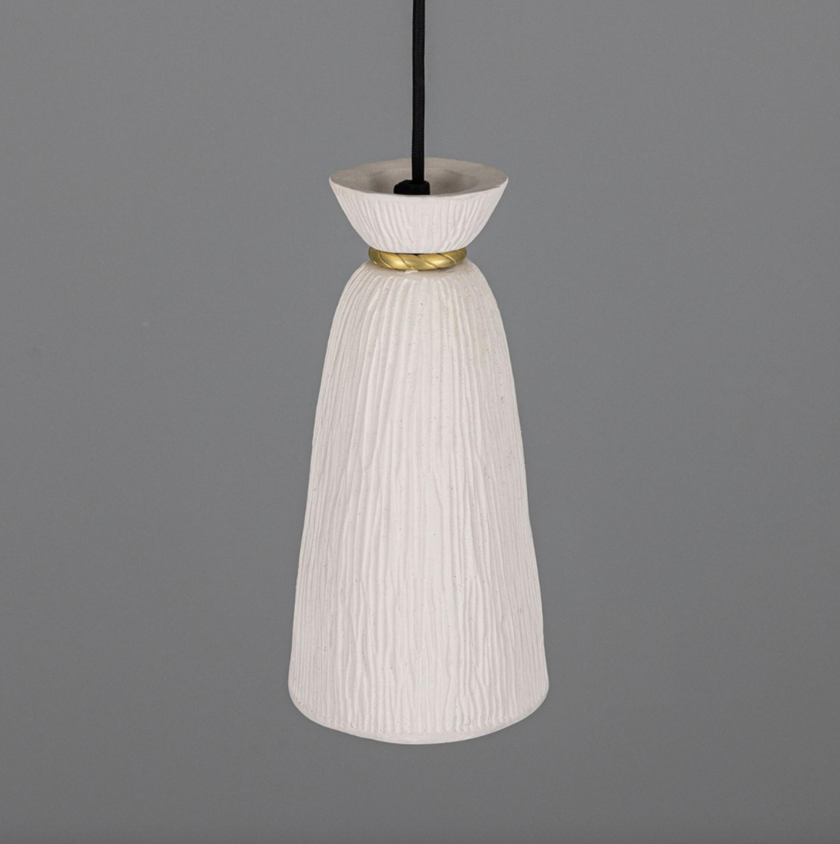 White textured pendant light with gold accent on a gray background