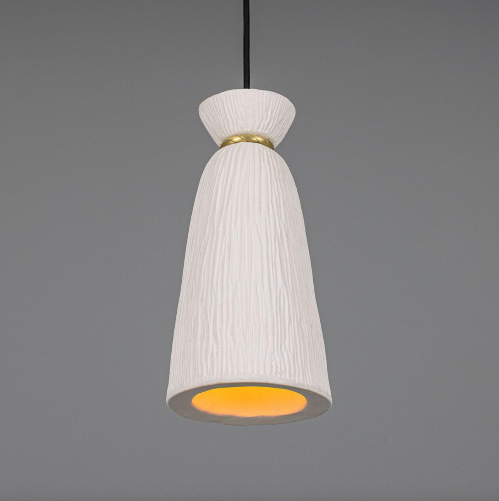 White textured pendant light with a gold interior on a gray background
