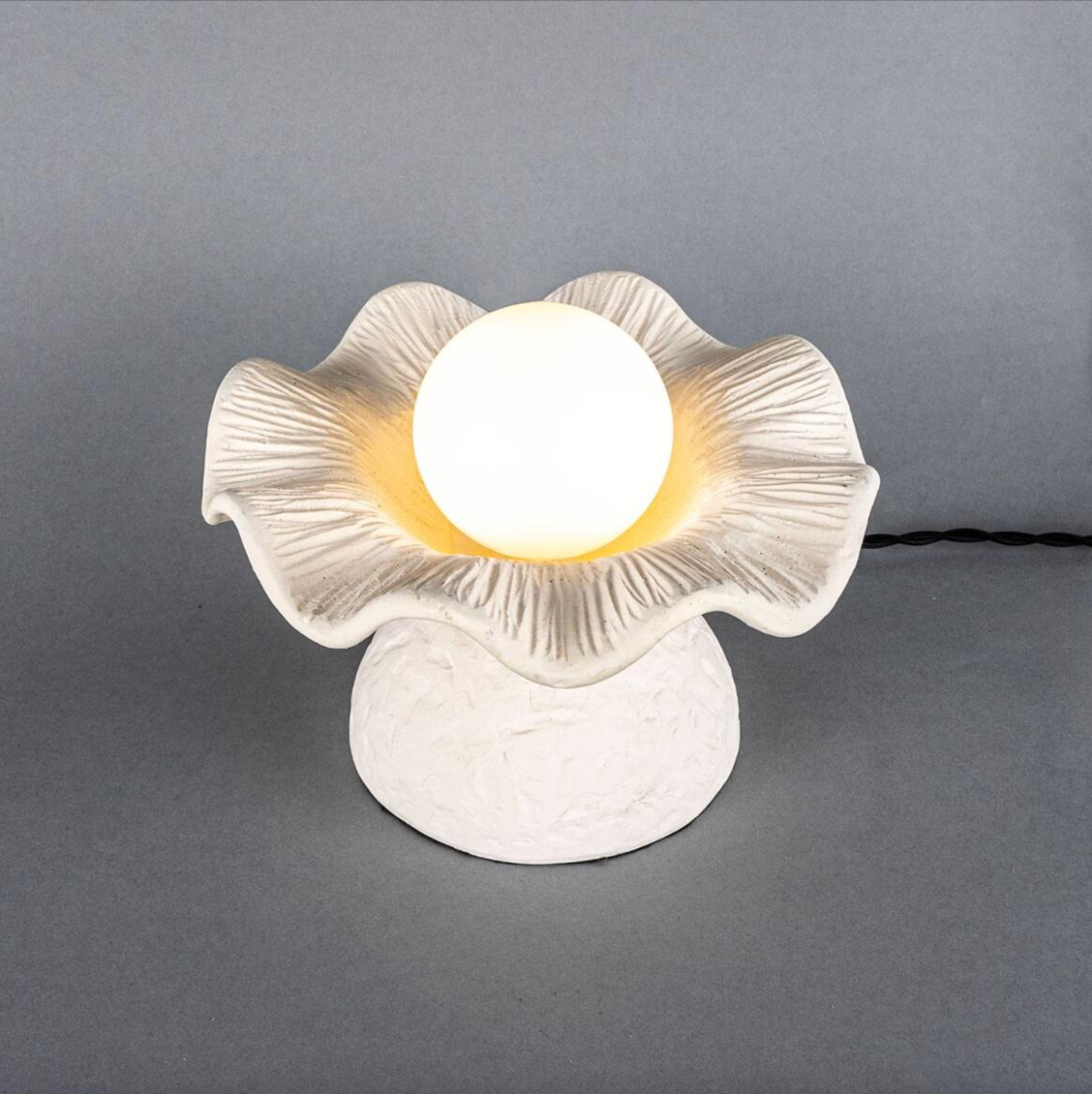 Decorative table lamp with a floral design on a gray background