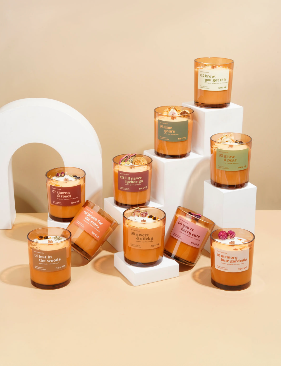 Collection of candles with labels on a beige background