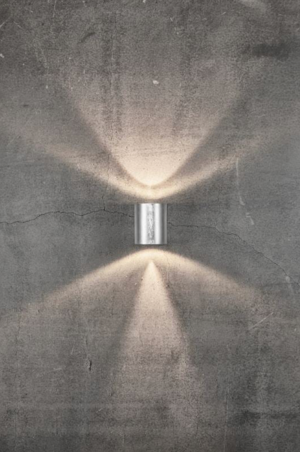 Wall-mounted light fixture casting a beam on a textured wall