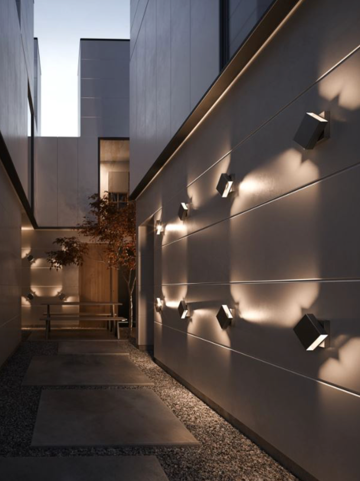 Modern architectural setting with wall-mounted lights and a building exterior.