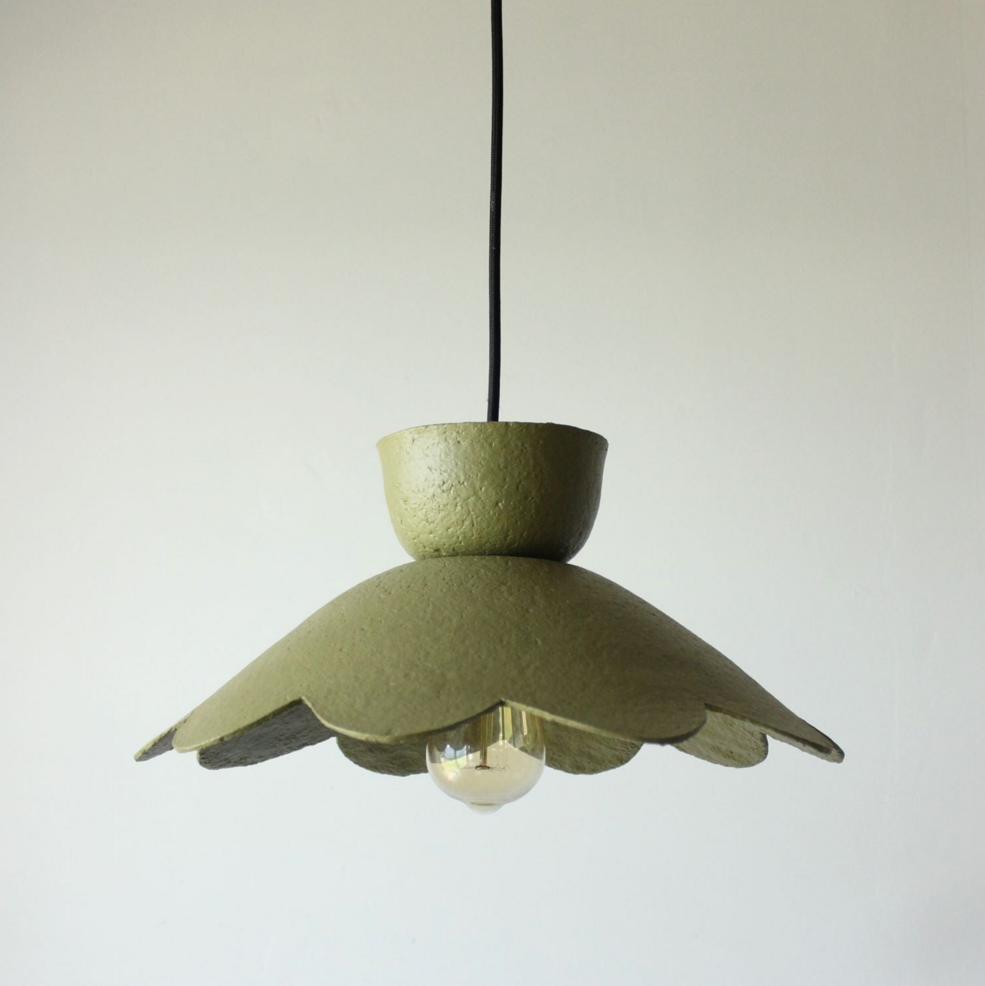 Green pendant lamp on a white background