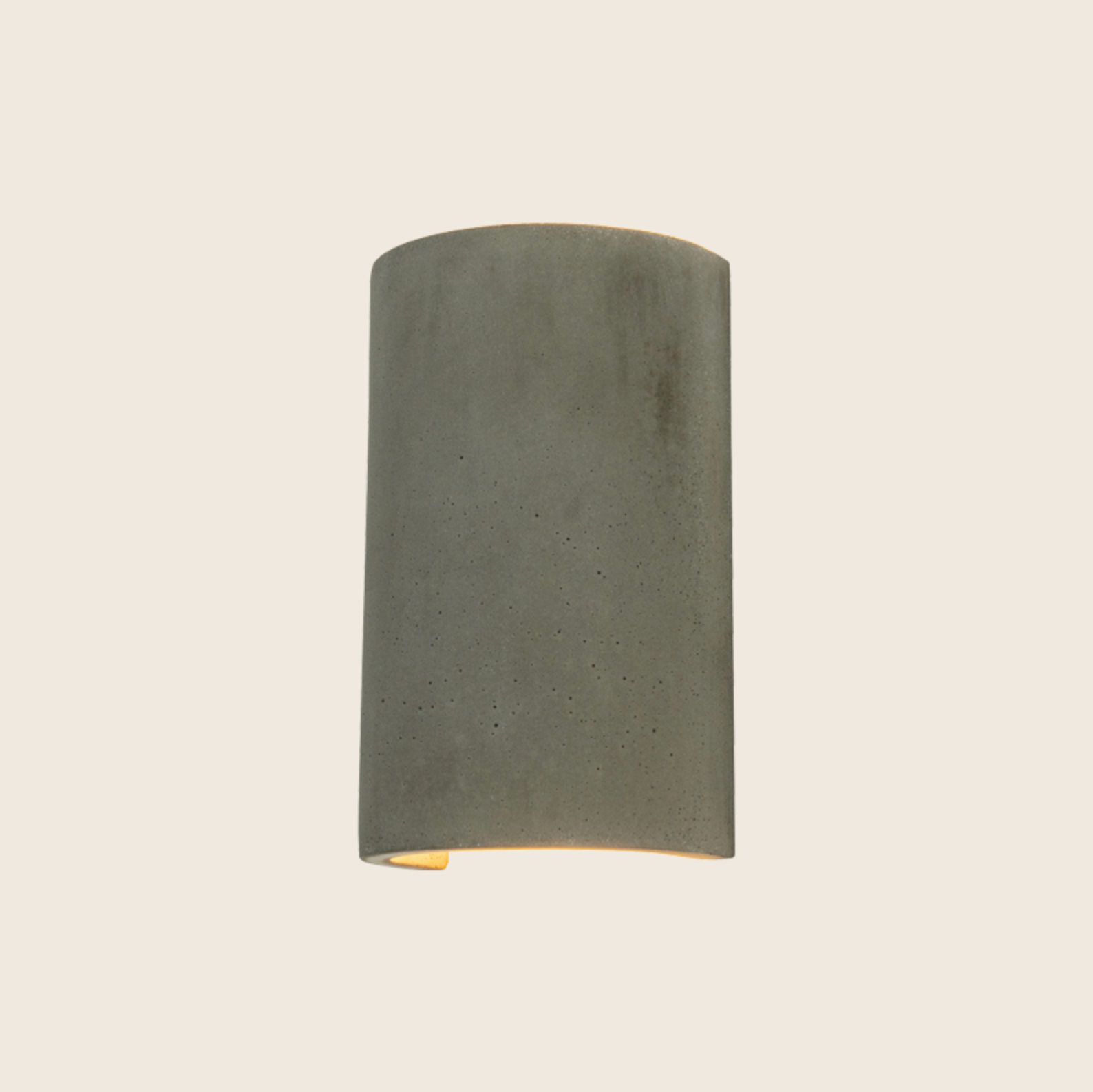 Cylindrical wall light fixture on a beige background
