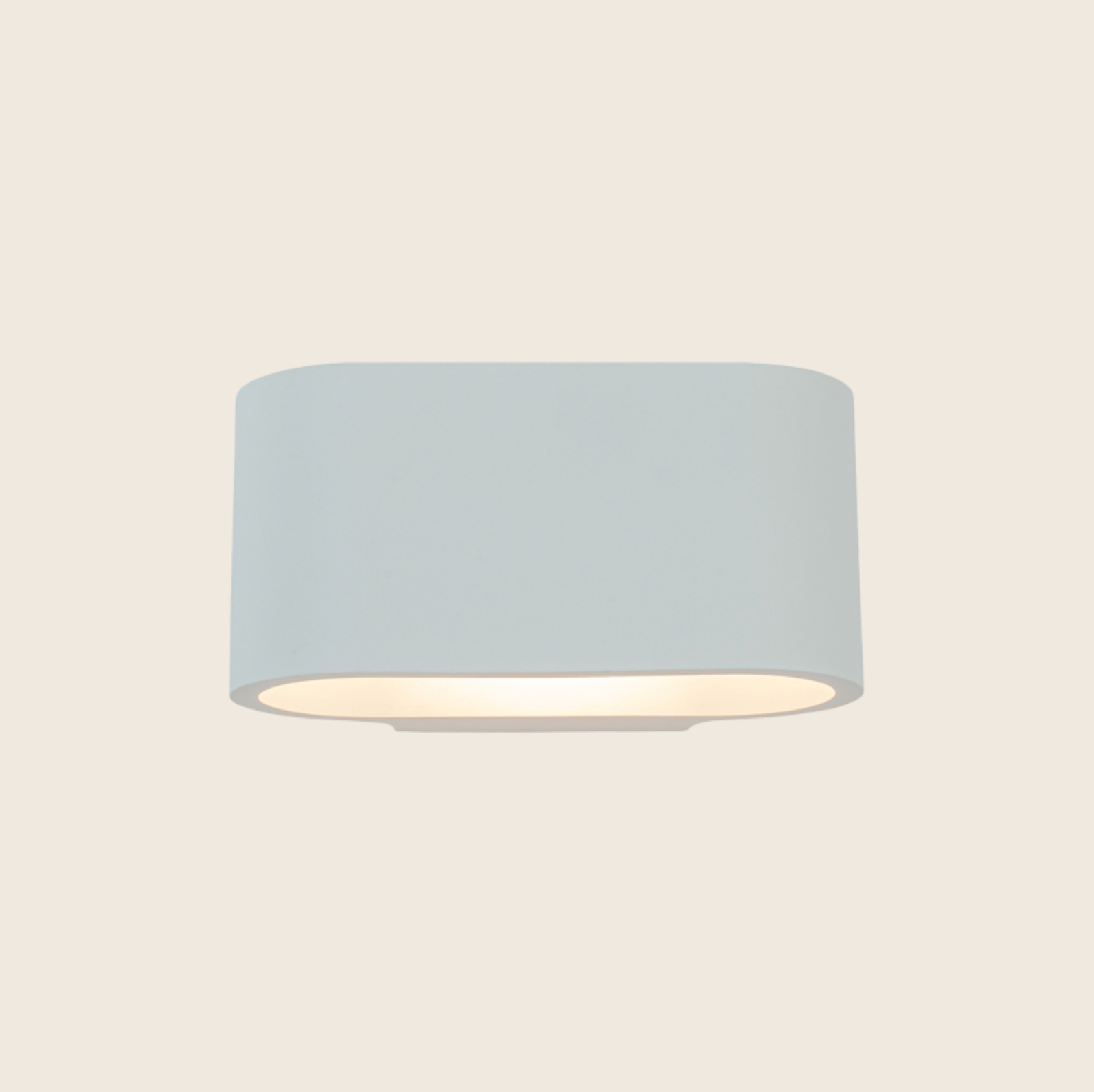 White curved wall light fixture on a beige background