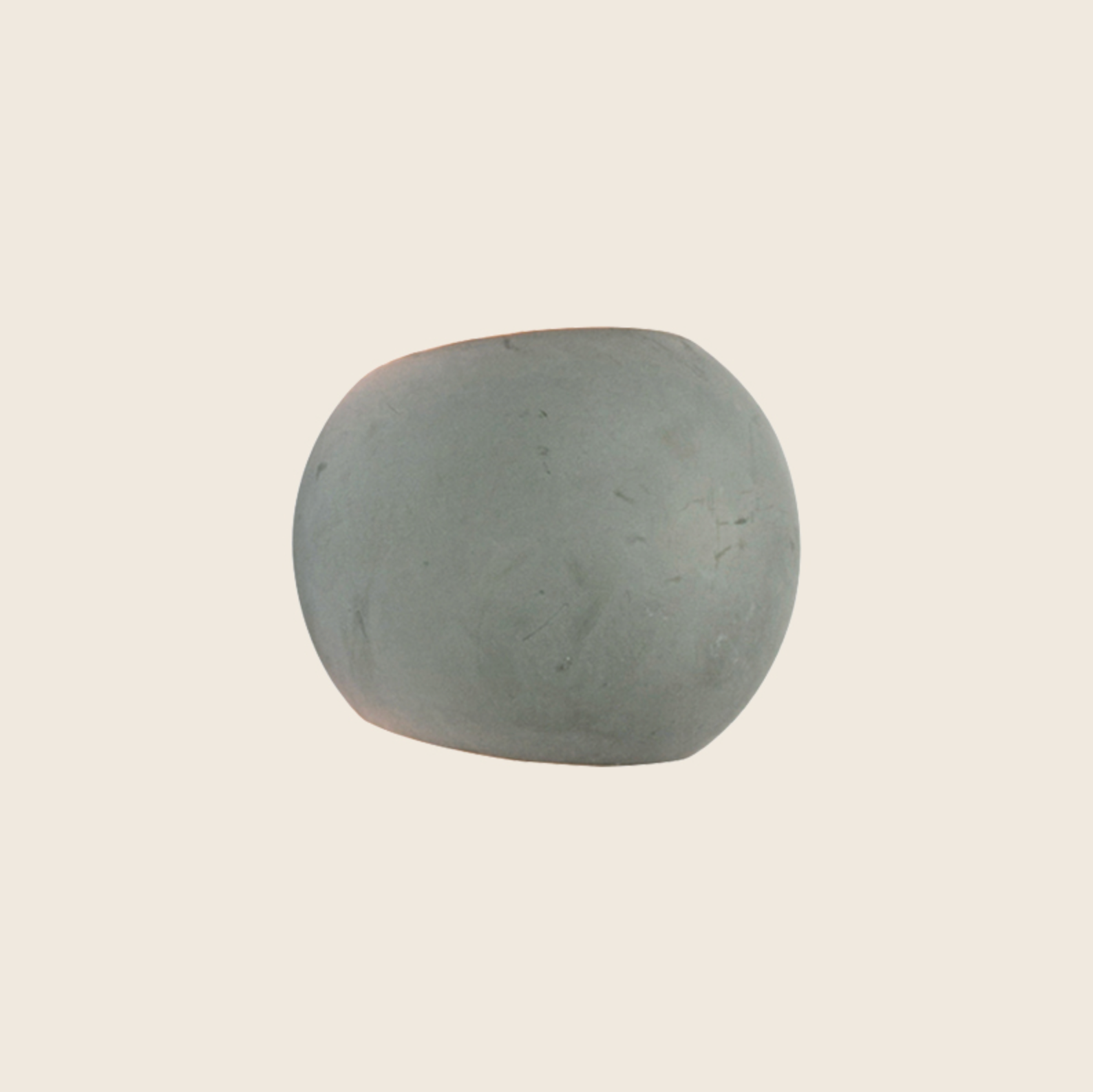 Grey stone wall light on a beige background