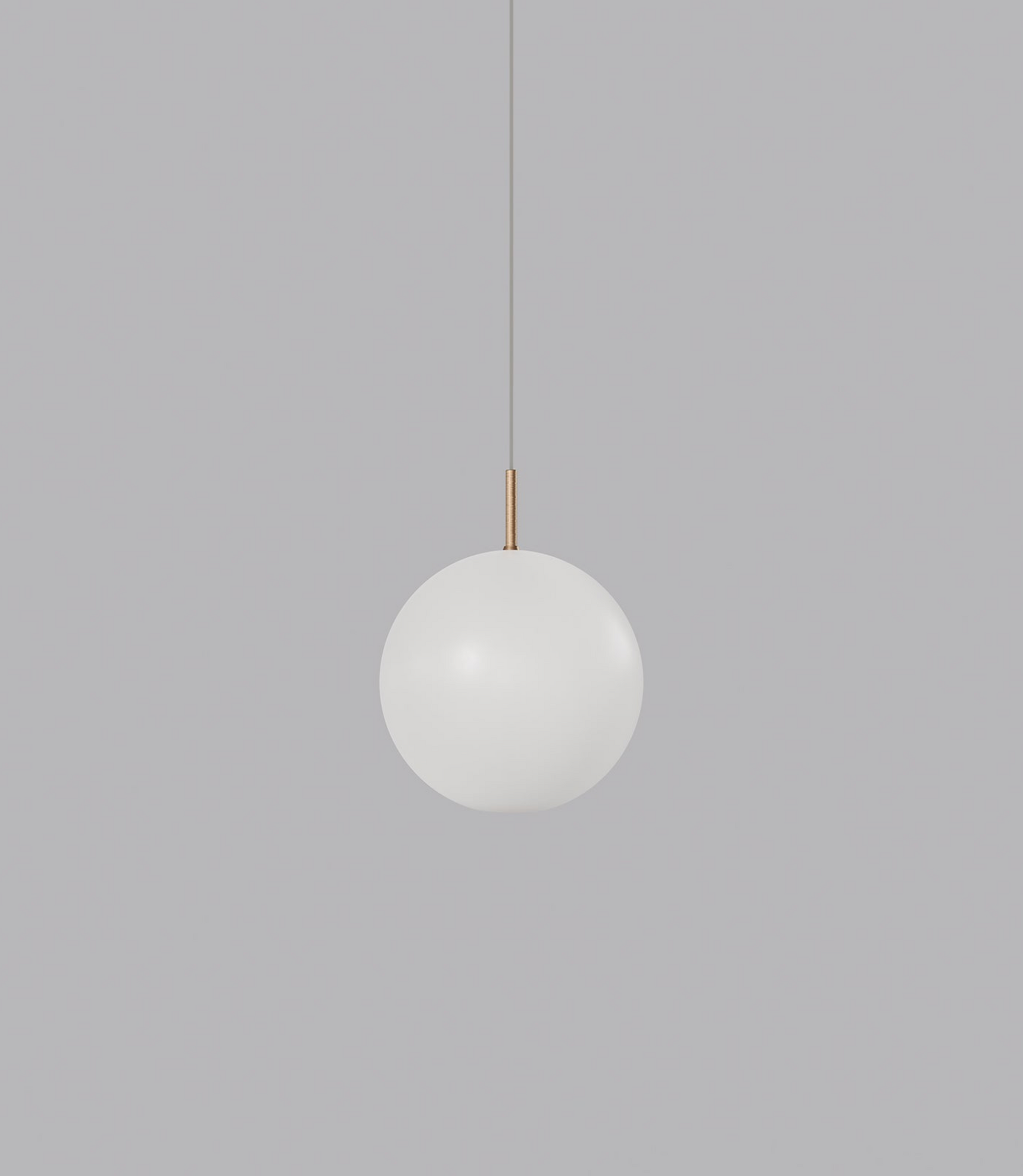 Spherical glass pendant light hanging against a grey background