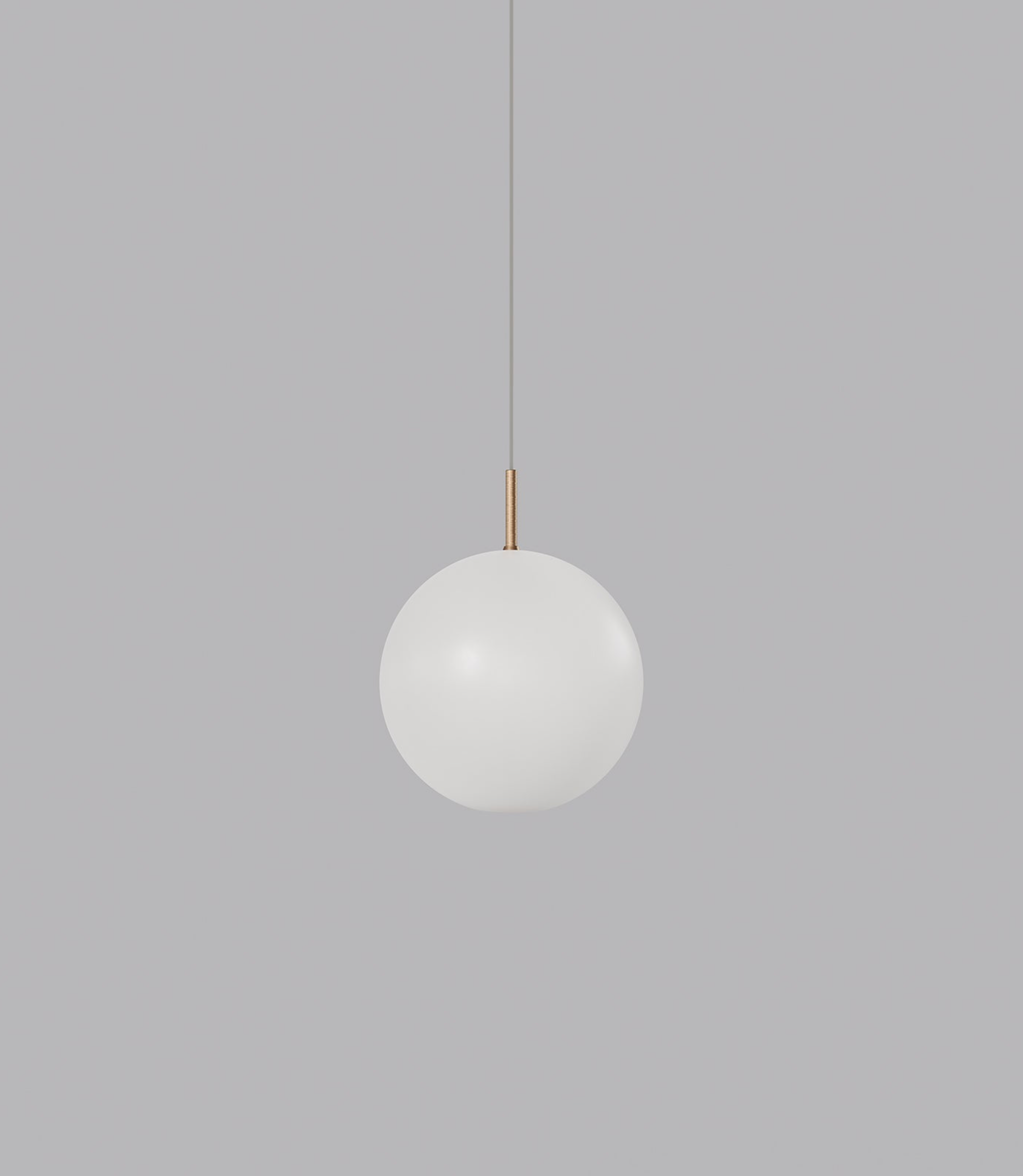 Spherical glass pendant light hanging against a grey background