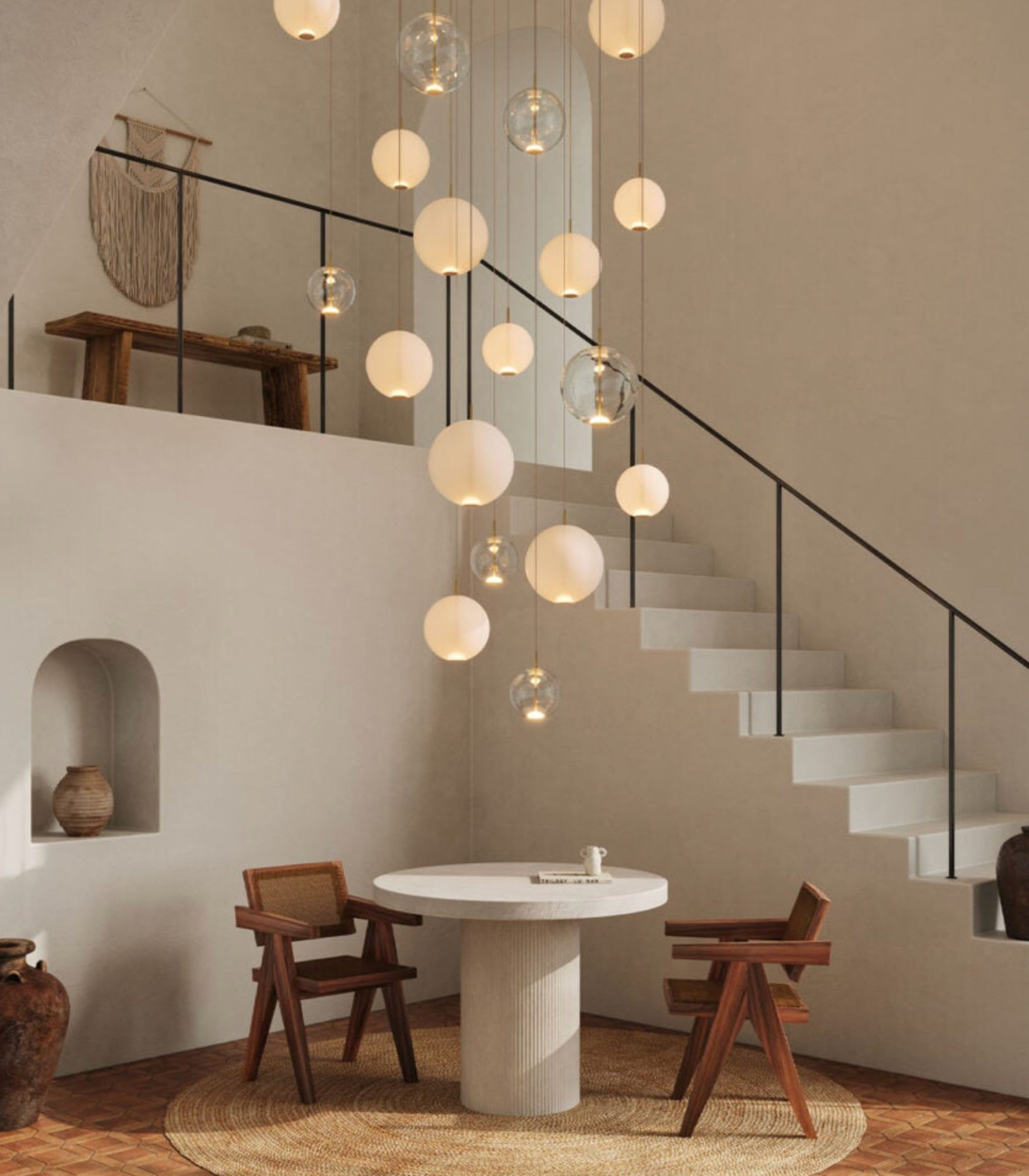 Modern interior with a staircase, round table, and glass pendant lights.