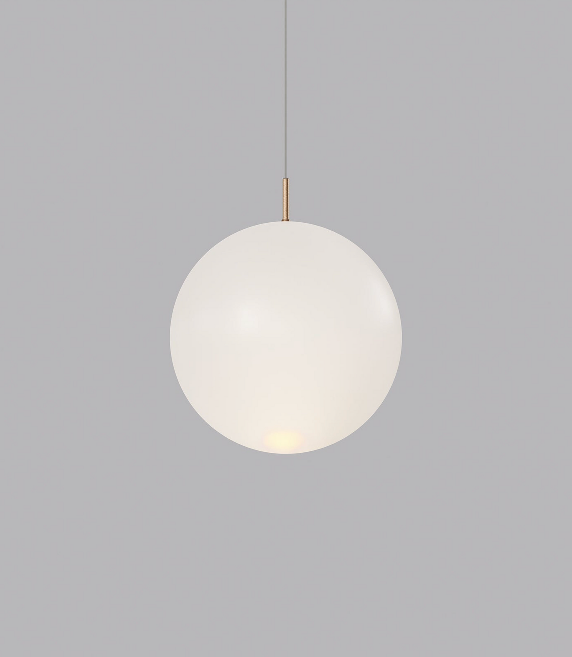 Spherical glass pendant light on a grey background