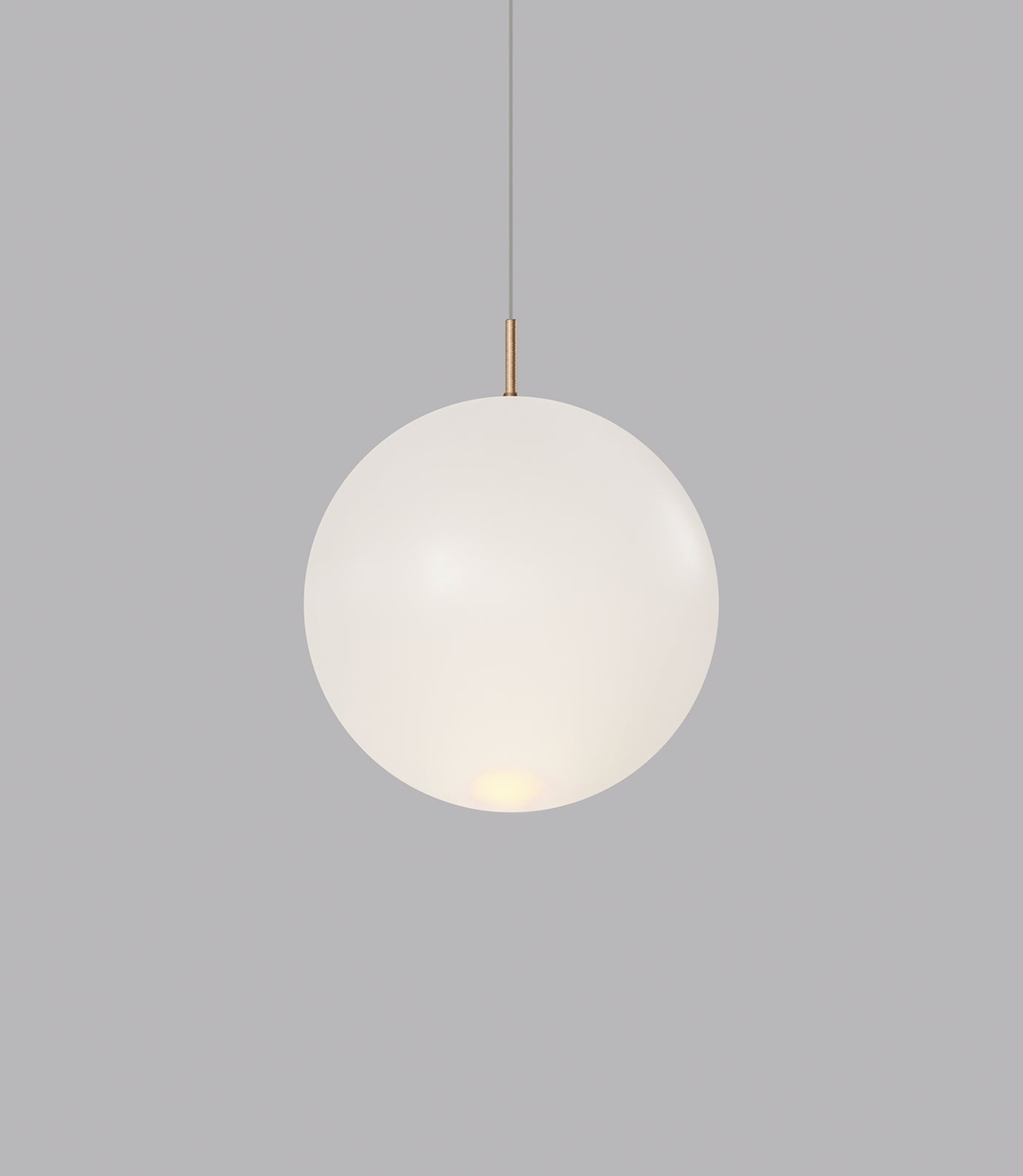Spherical glass pendant light on a grey background