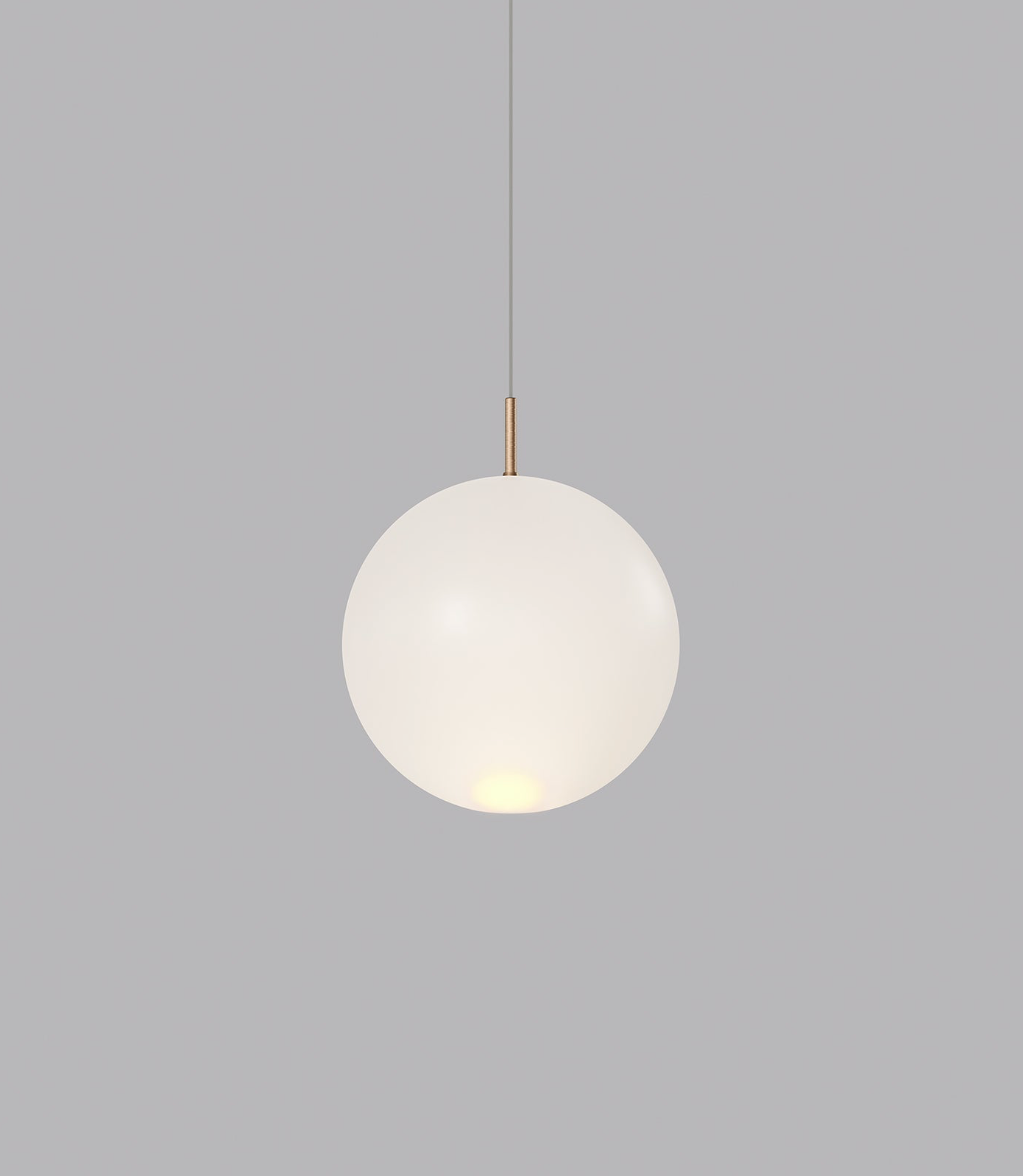 Spherical glass pendant light on a grey background