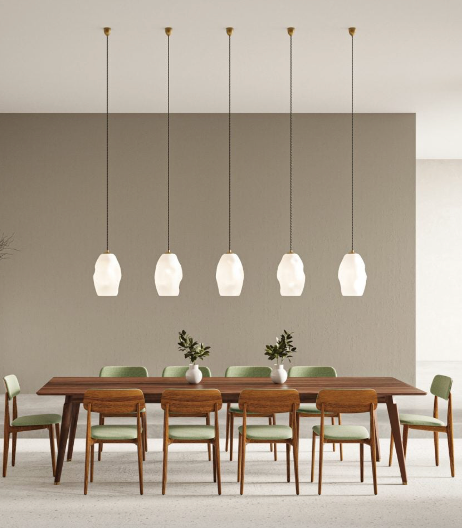 Dining room with wooden table and chairs under feature white glass pendant lights.