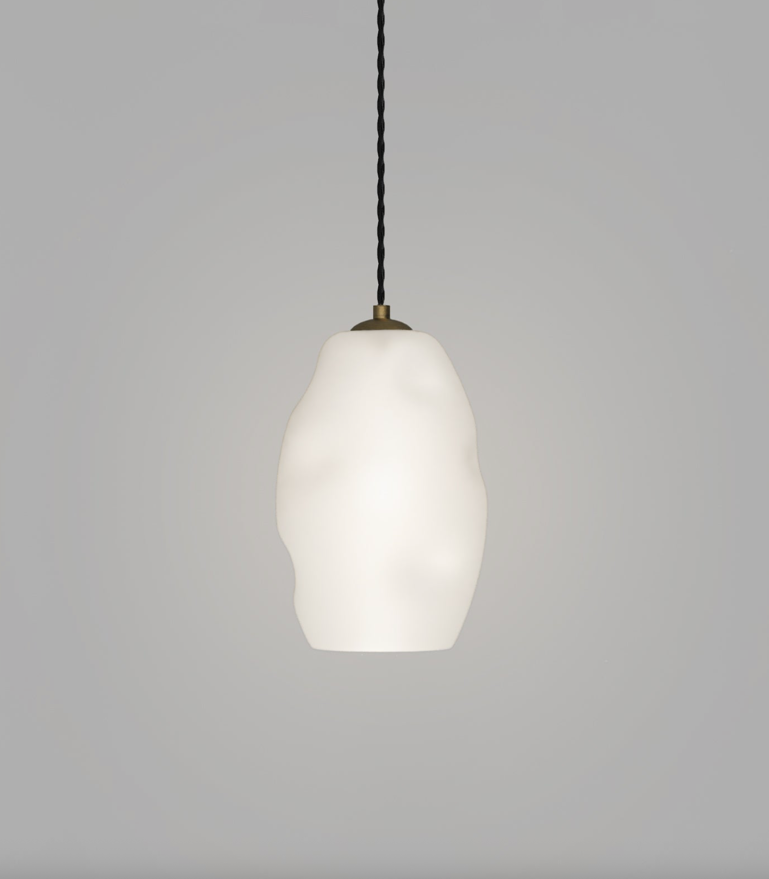 White glass pendant light with a black cord on a gray background