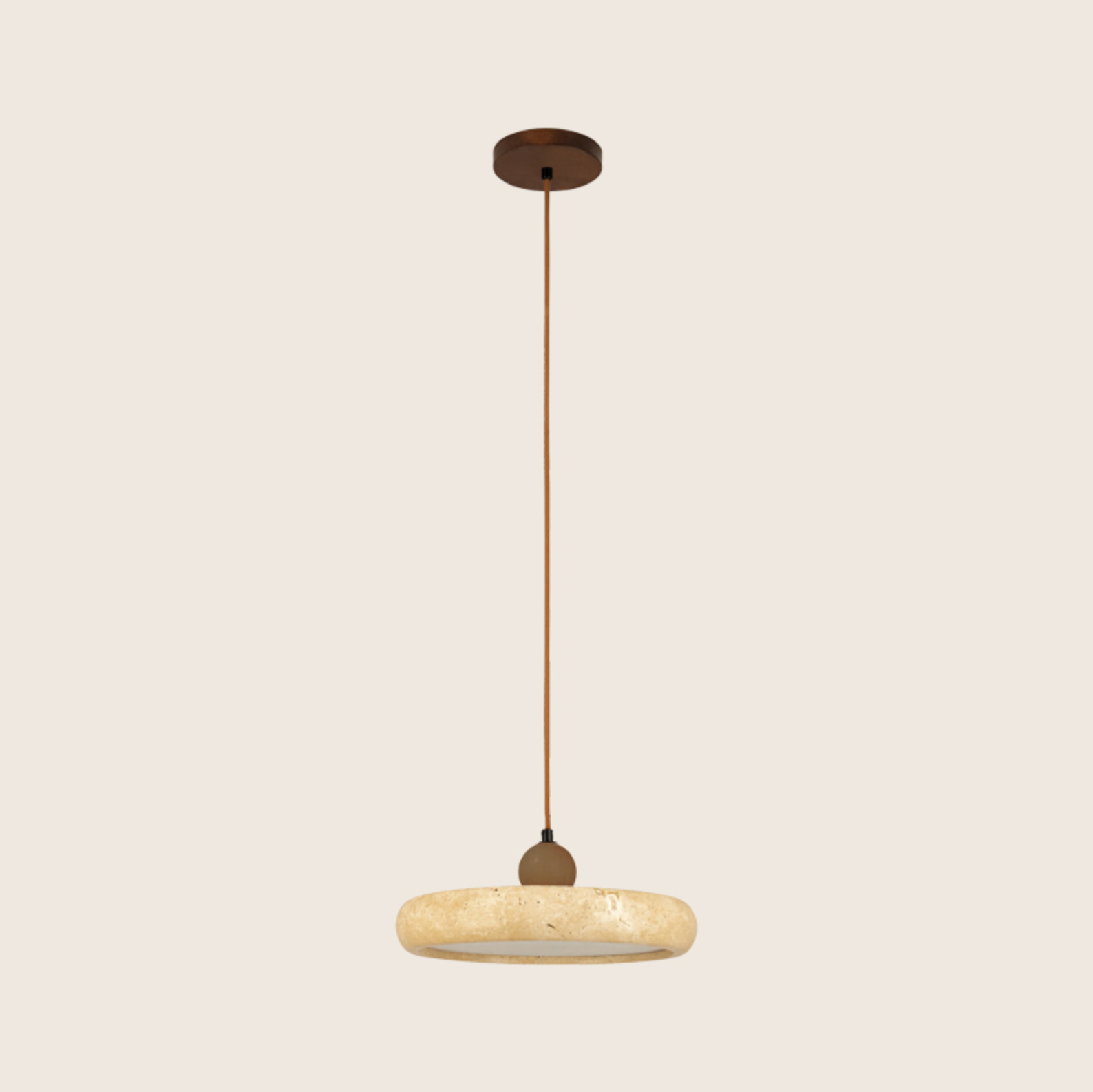 Pendant light with a textured stone shade on a beige background