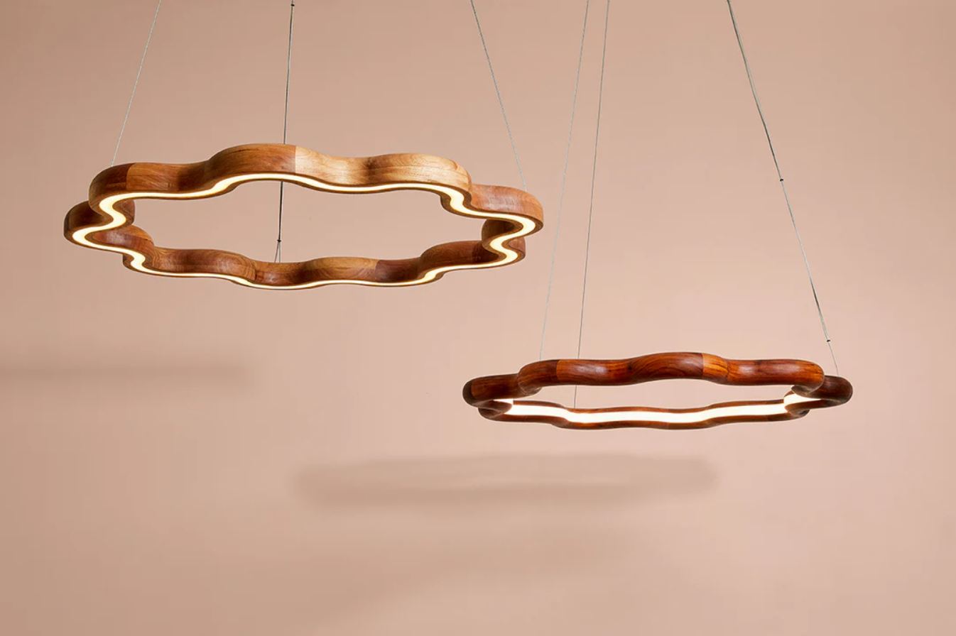 Modern wooden pendant light fixture with a unique design on a beige background