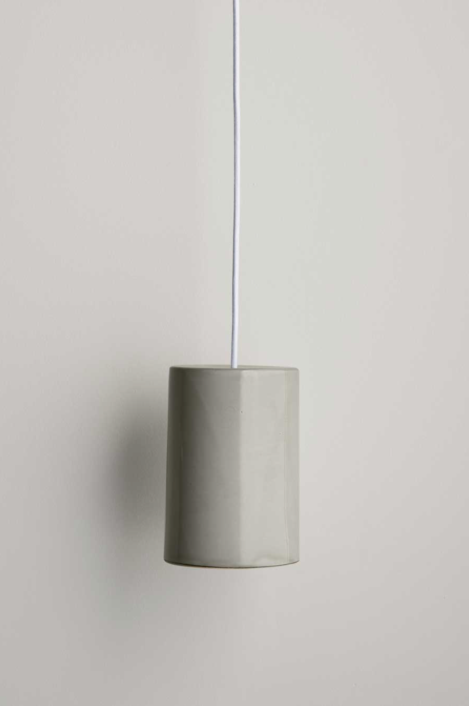 Ceramic pendant light on a neutral background