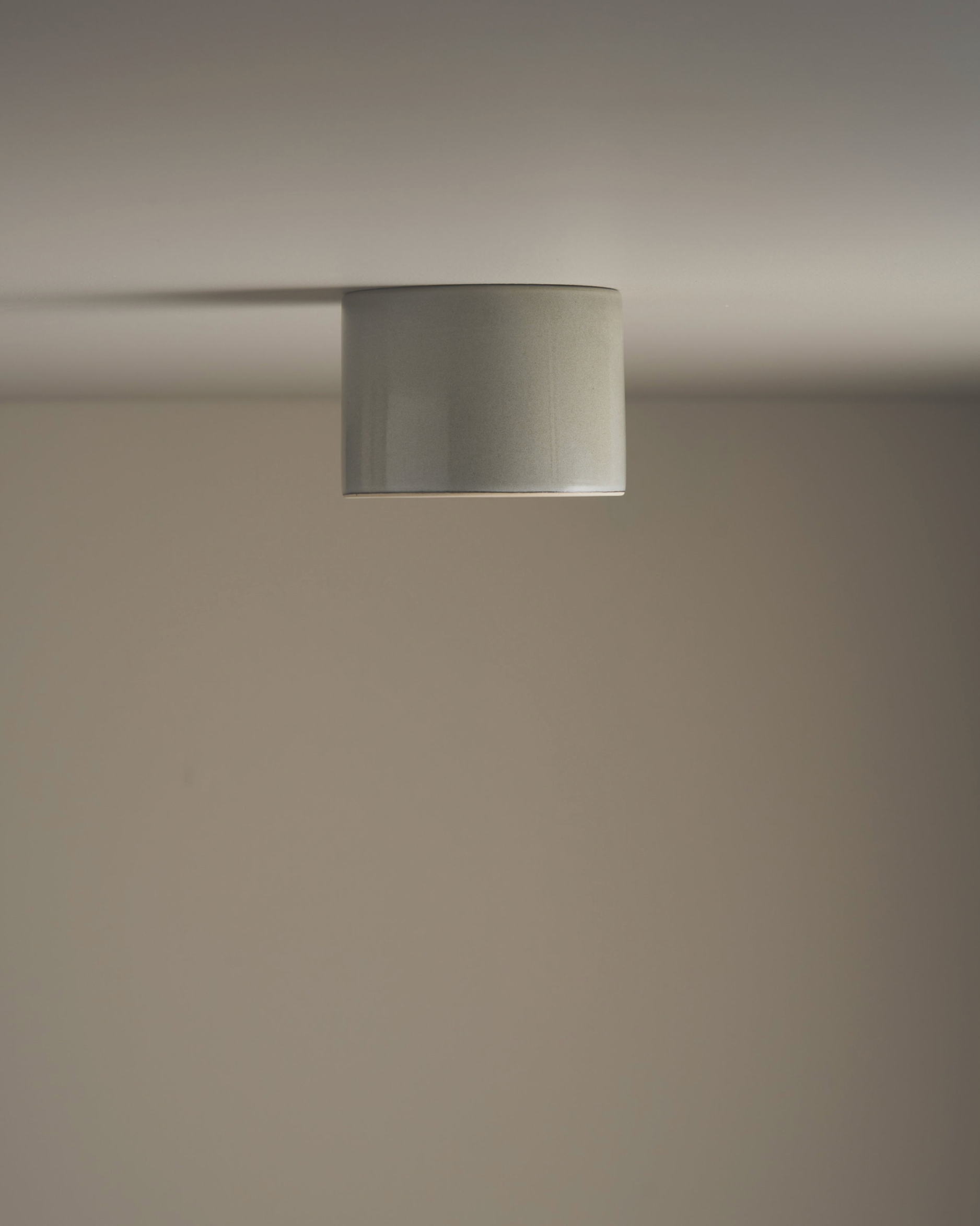 Ceramic ceiling light fixture on a neutral background