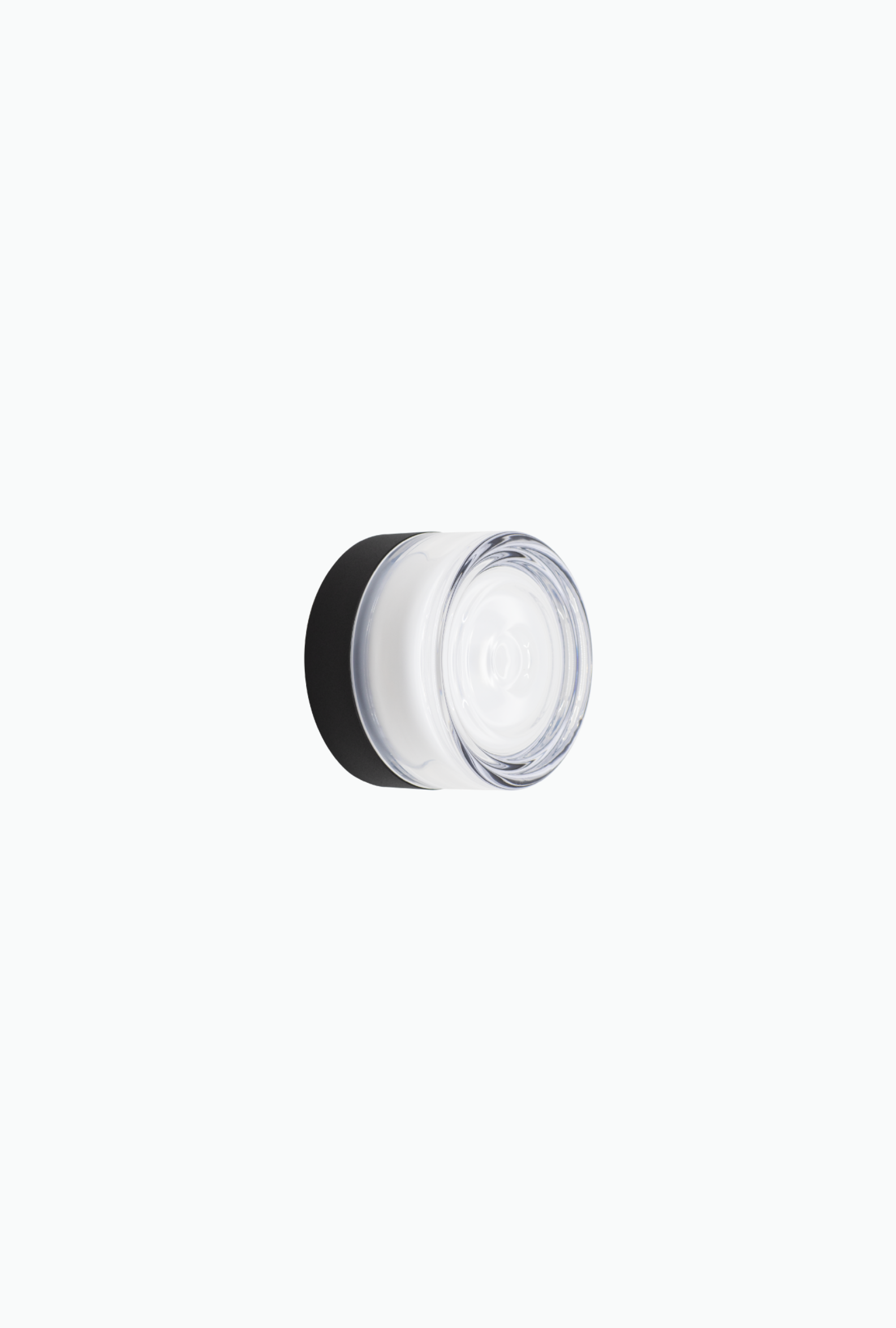 Small round wall light with a black lid on a white background