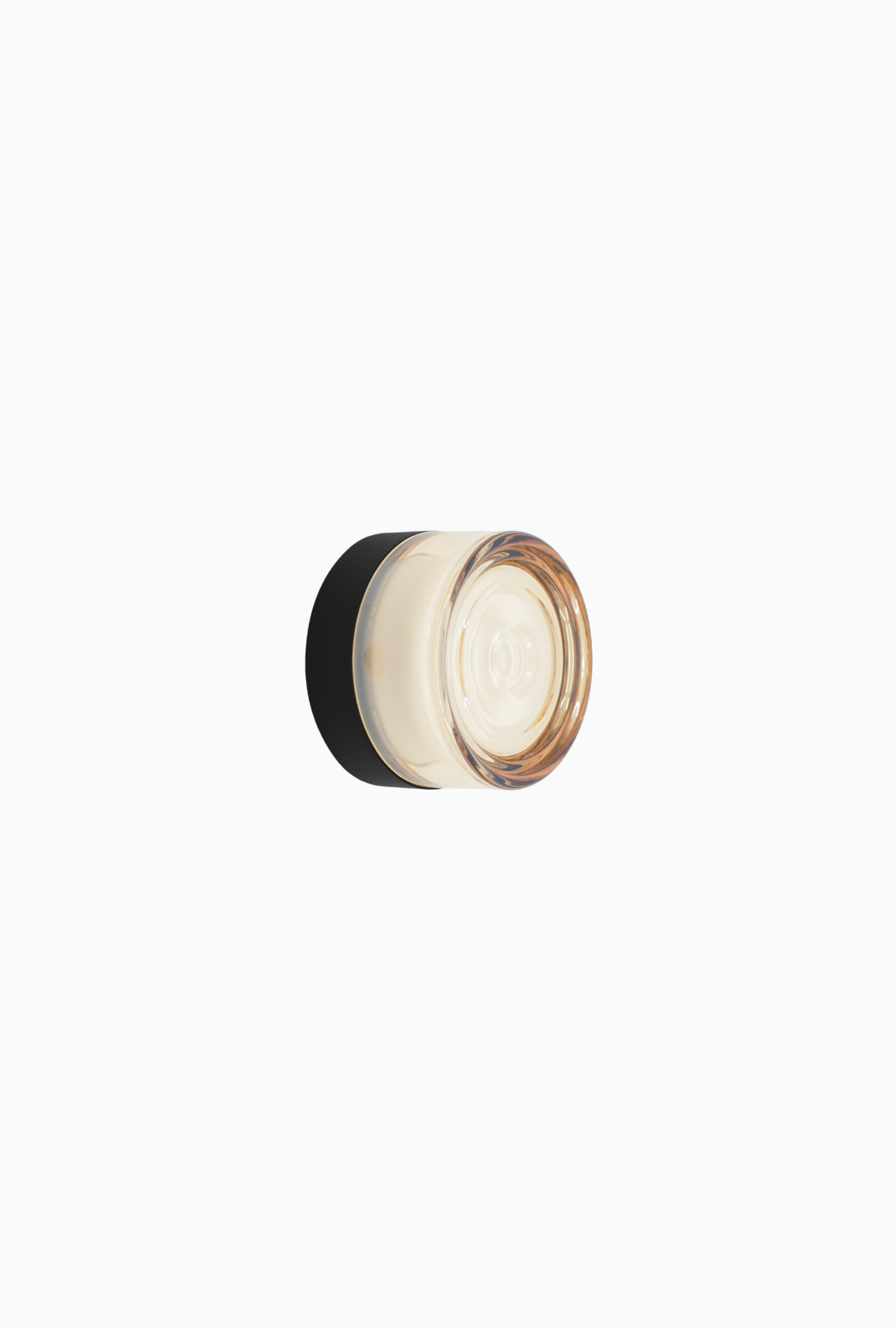 Round wall light fixture on a white background