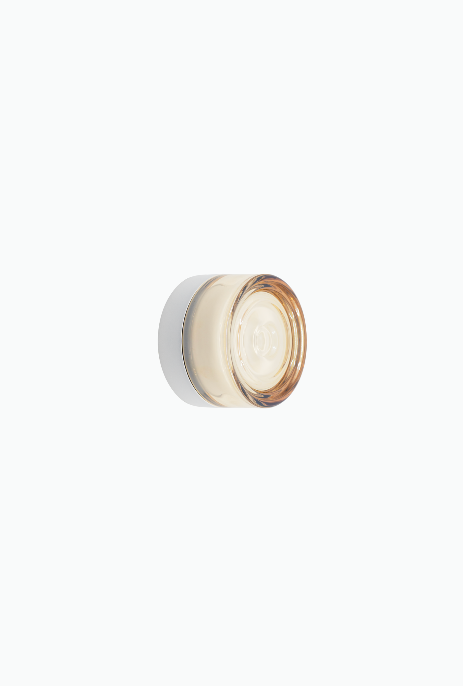 Round wall light fixture on a white background