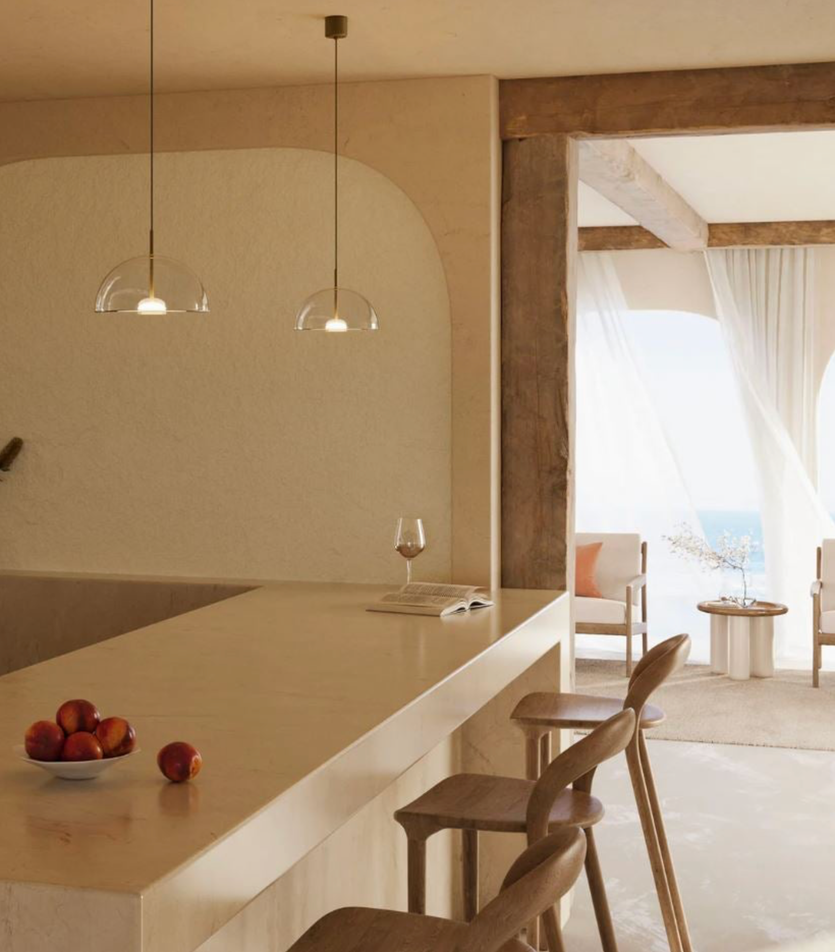 Modern kitchen with a bar counter, pendant lights, and a view of a patio.