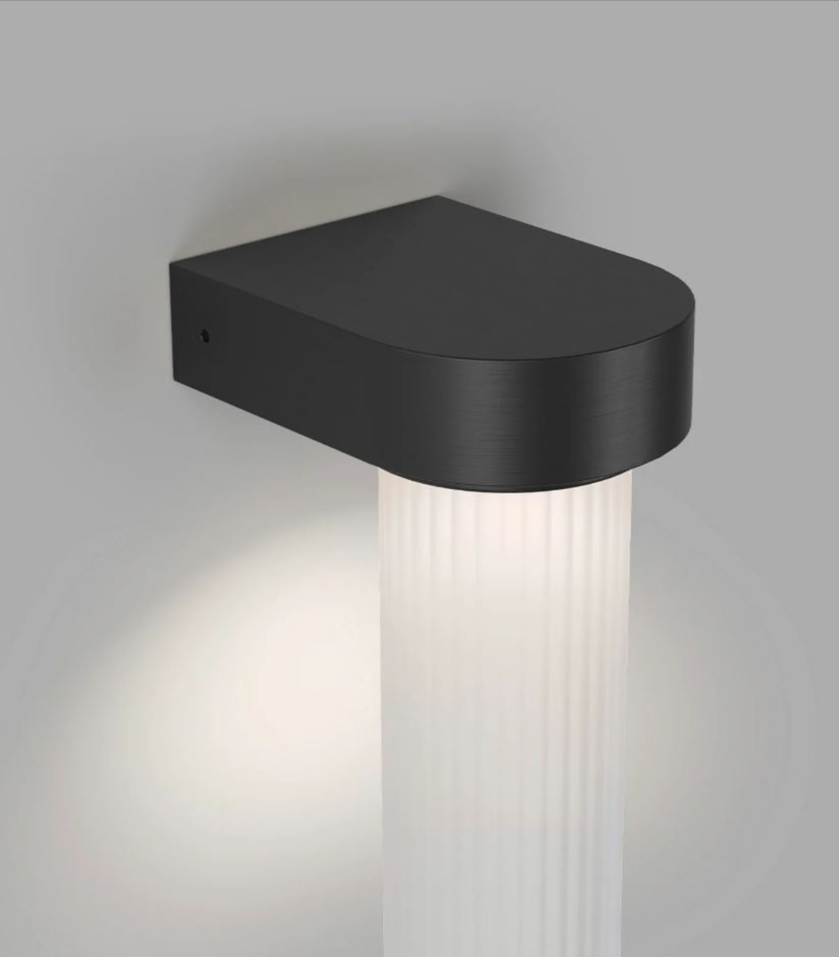 Black wall-mounted indoor light fixture on a grey background