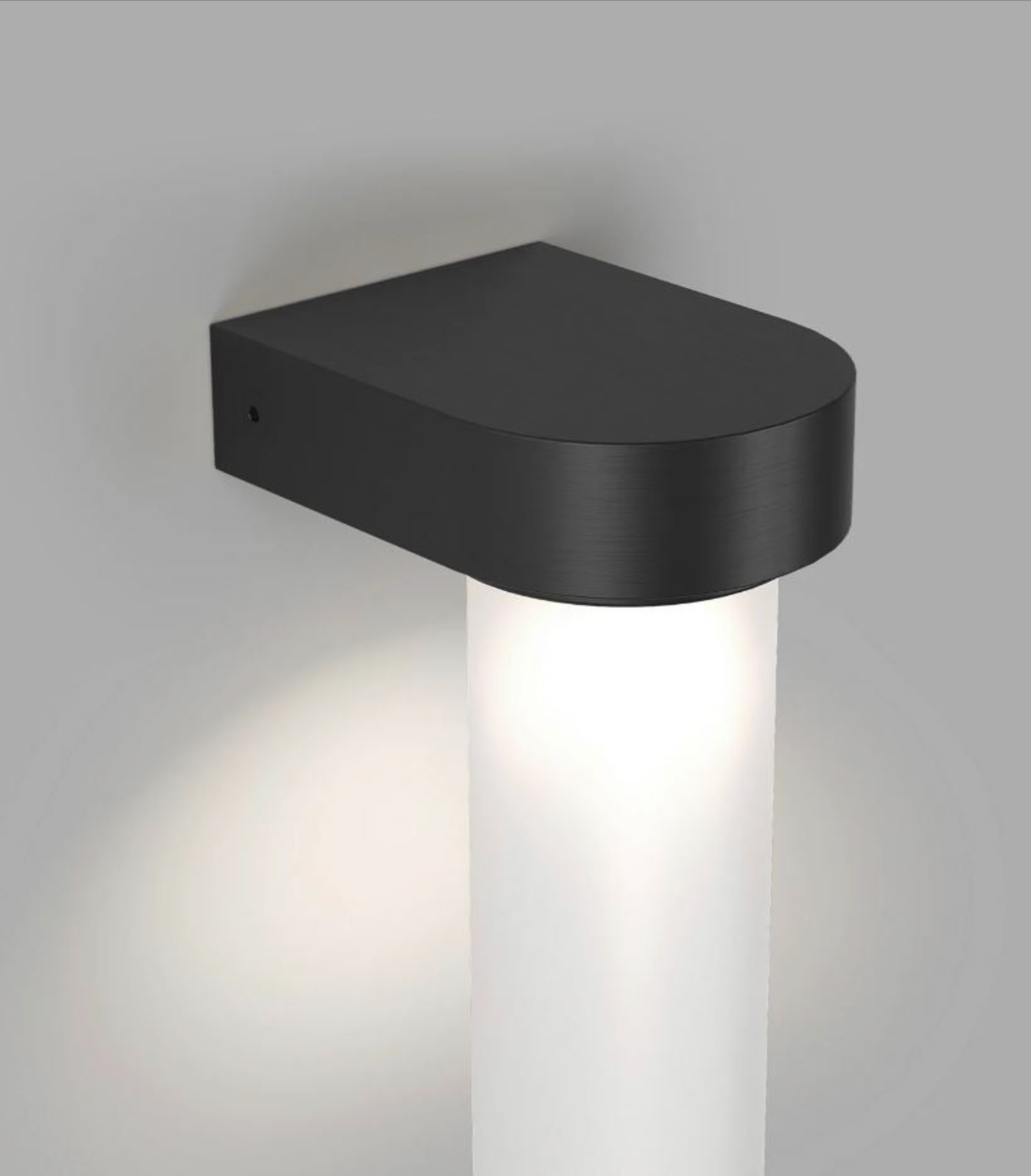 Black wall-mounted light fixture on a grey background