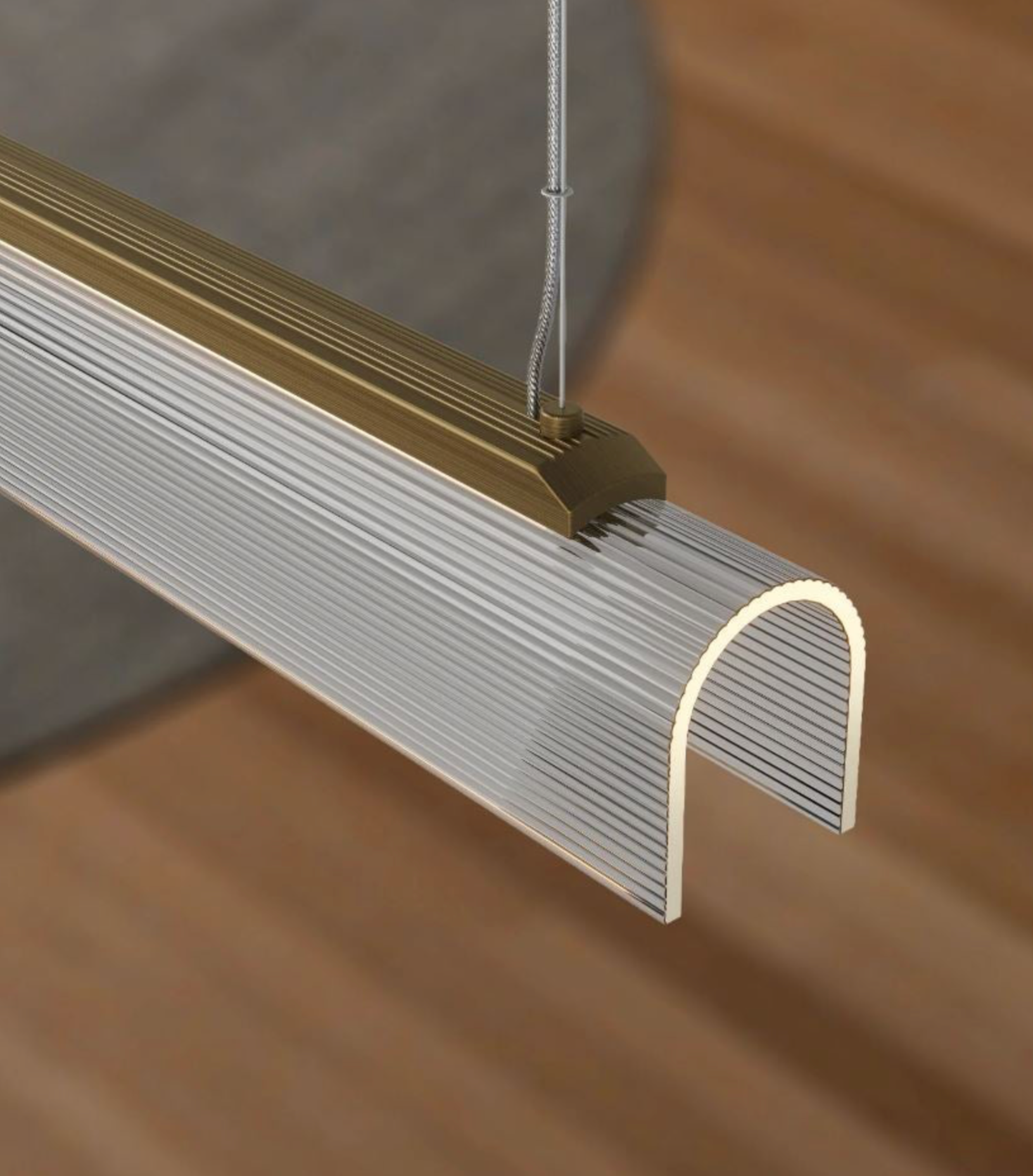 Linear pendant light with a curved finish 
