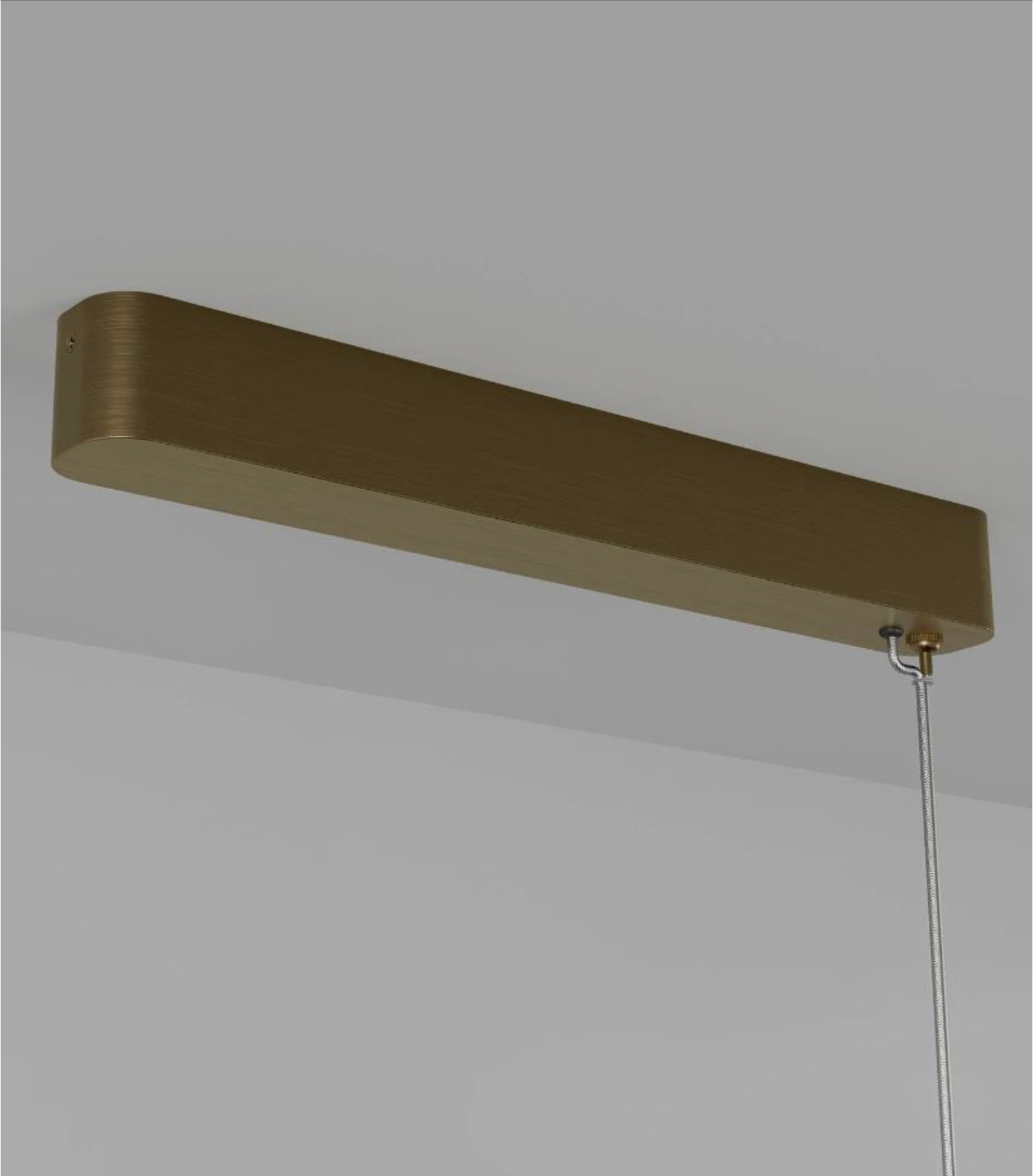 Long rectangular pendant light fixture on a plain background