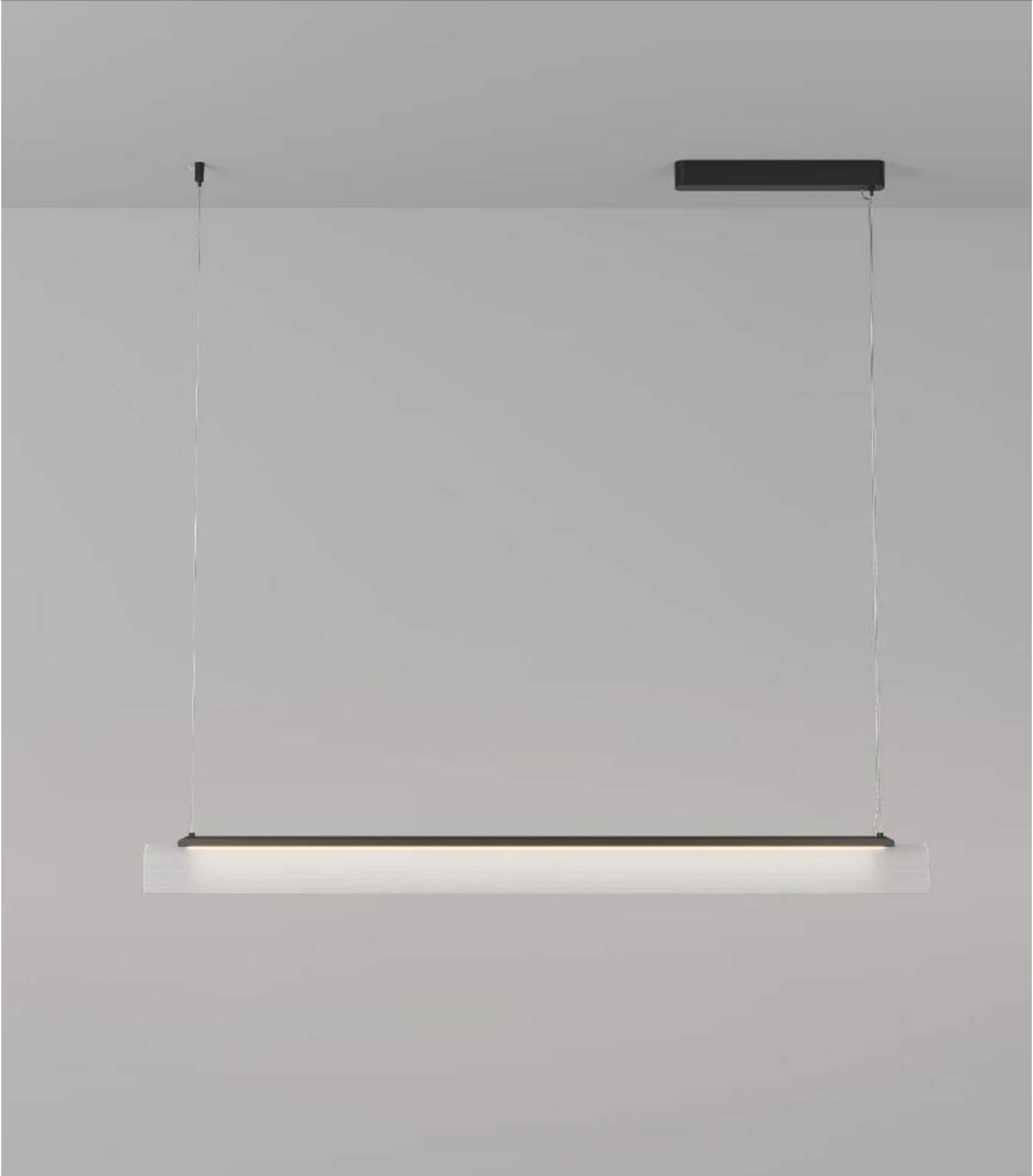 Modern linear pendant light fixture on a grey background