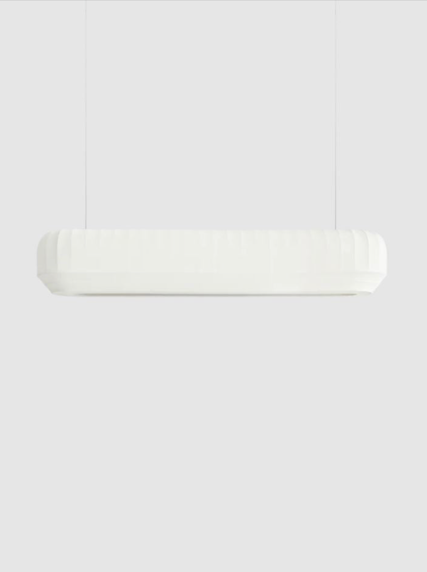 Linear pendant light on a white background
