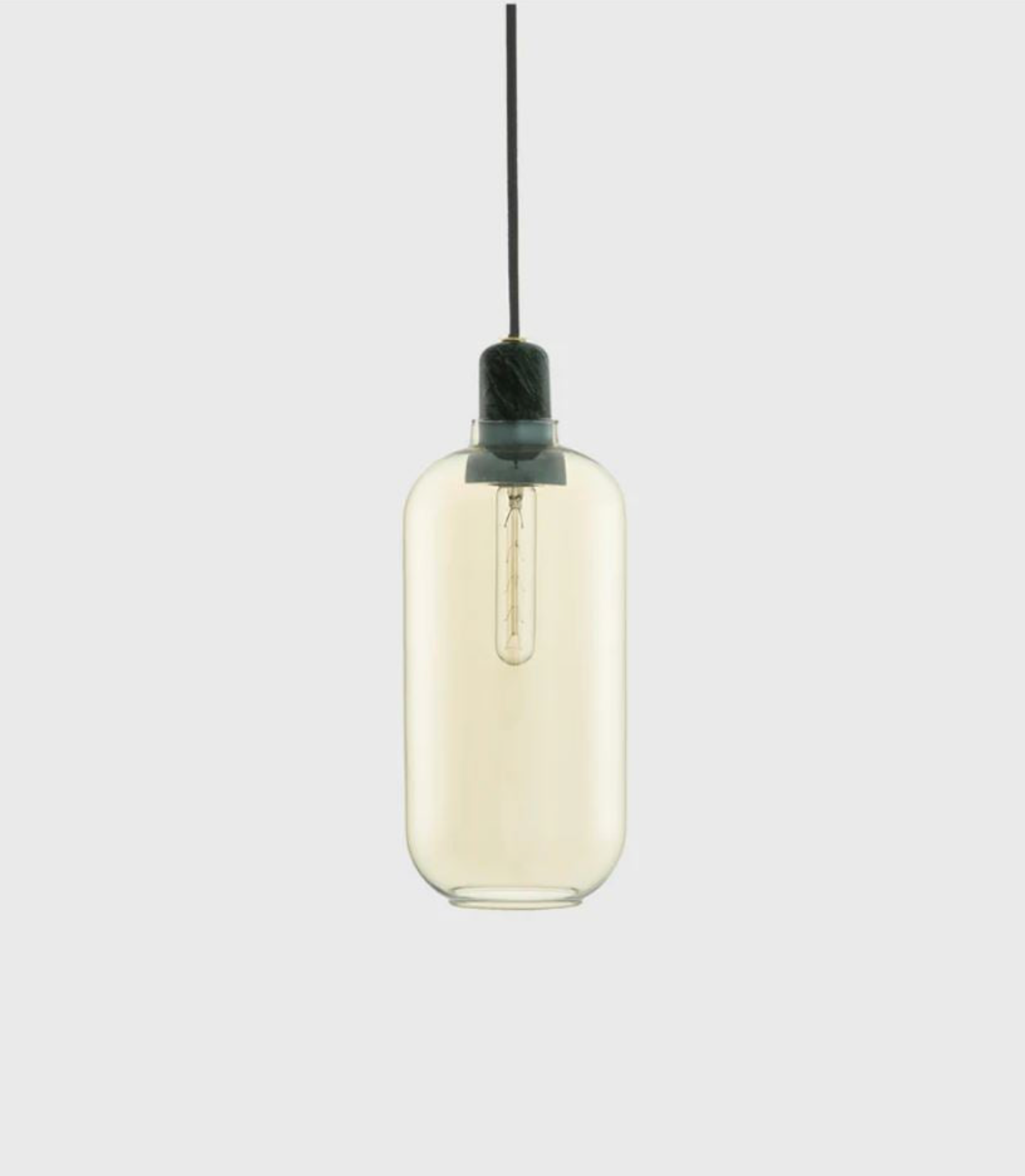 Gold glass pendant light with black cord on a white background