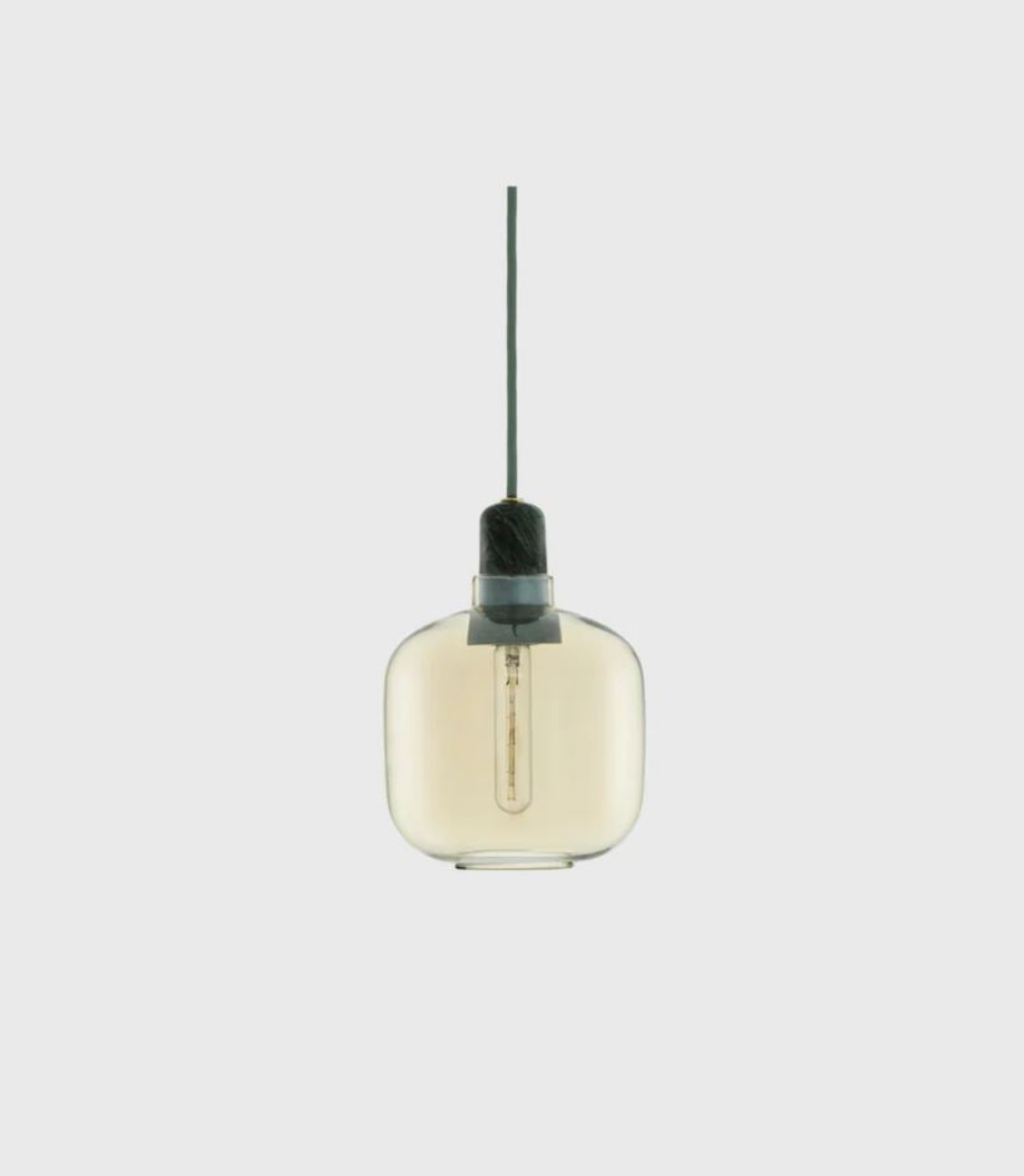 Pendant light with amber glass shade on a white background