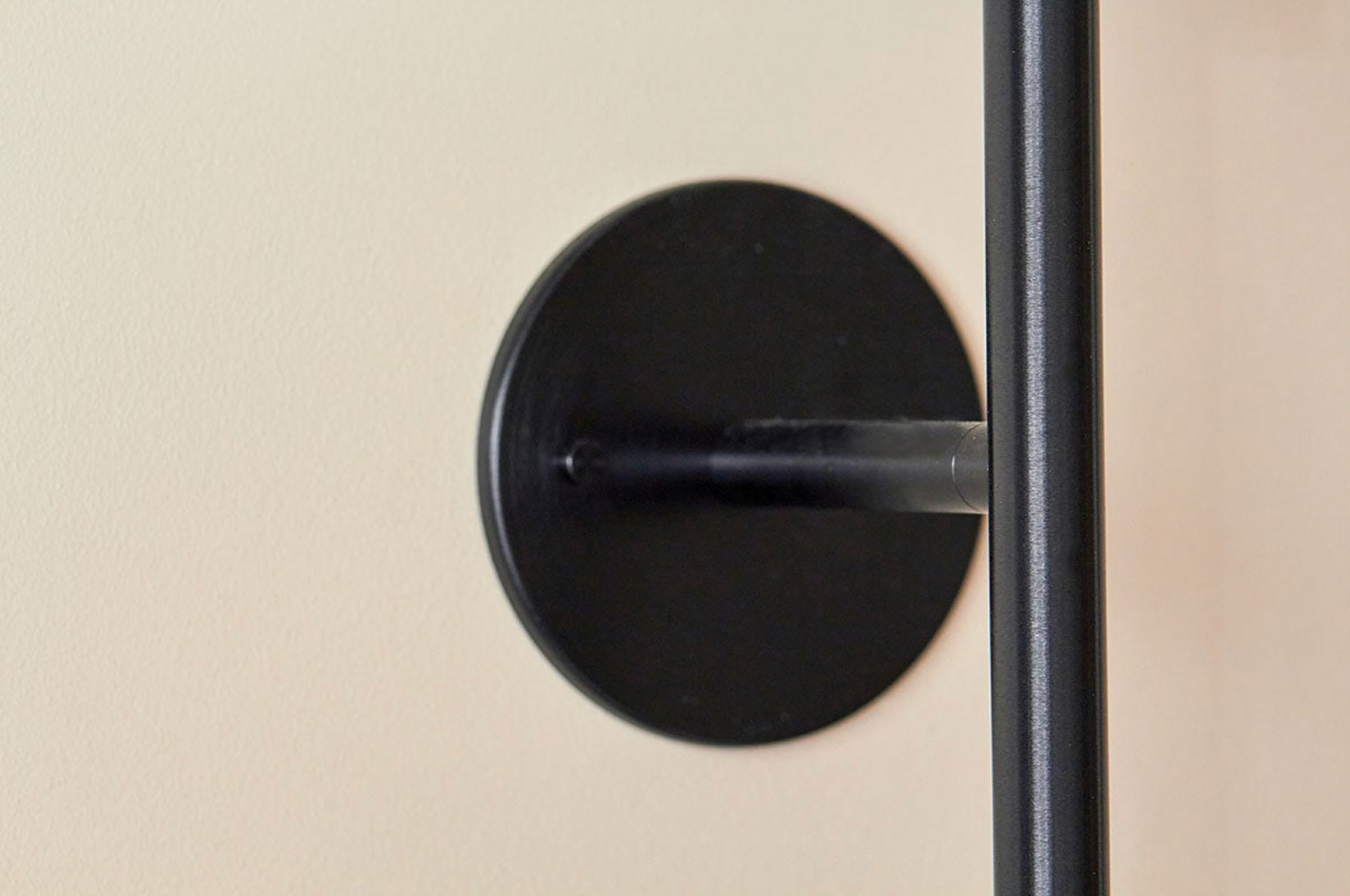 Close-up of a wall light on a beige wall