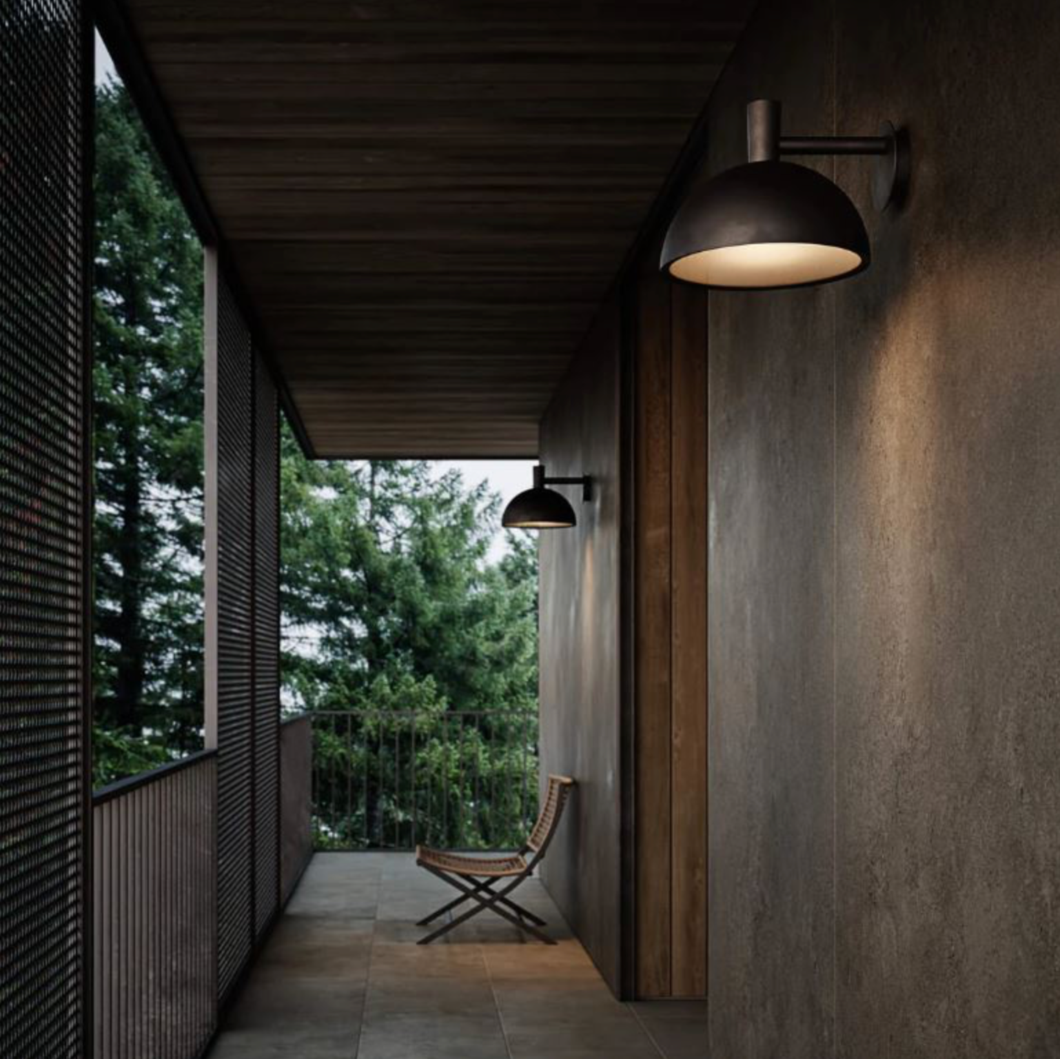 Modern outdoor setting with wall-mounted lights and a chair, surrounded by trees.