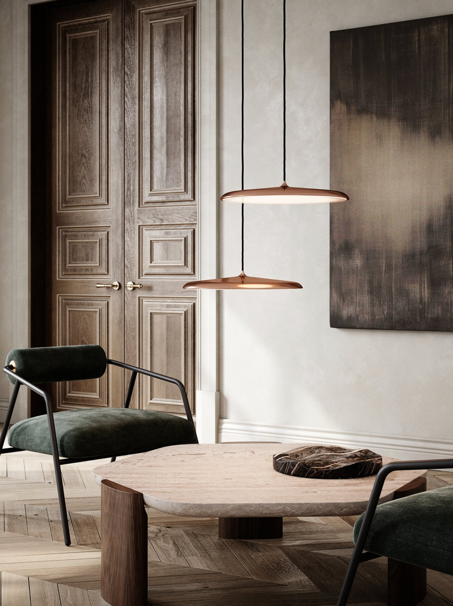 Modern interior with wooden table, chairs, and pendant lights.