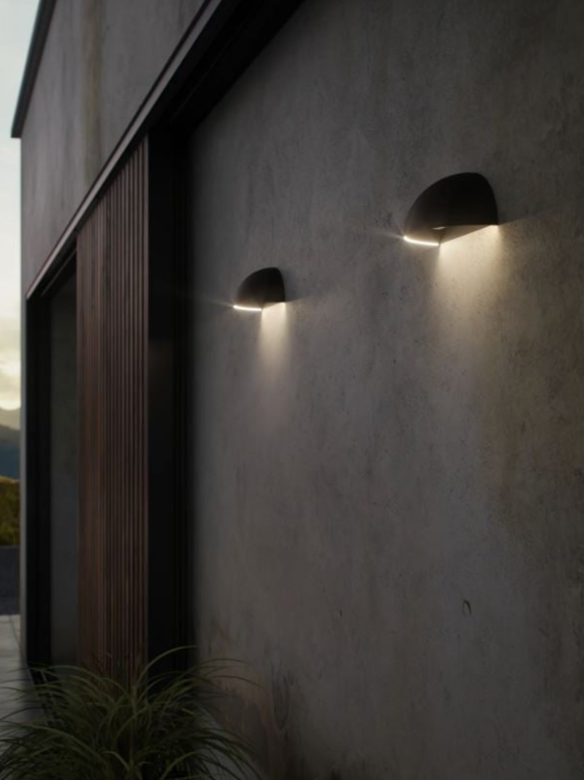 Two outdoor wall lights on a building exterior