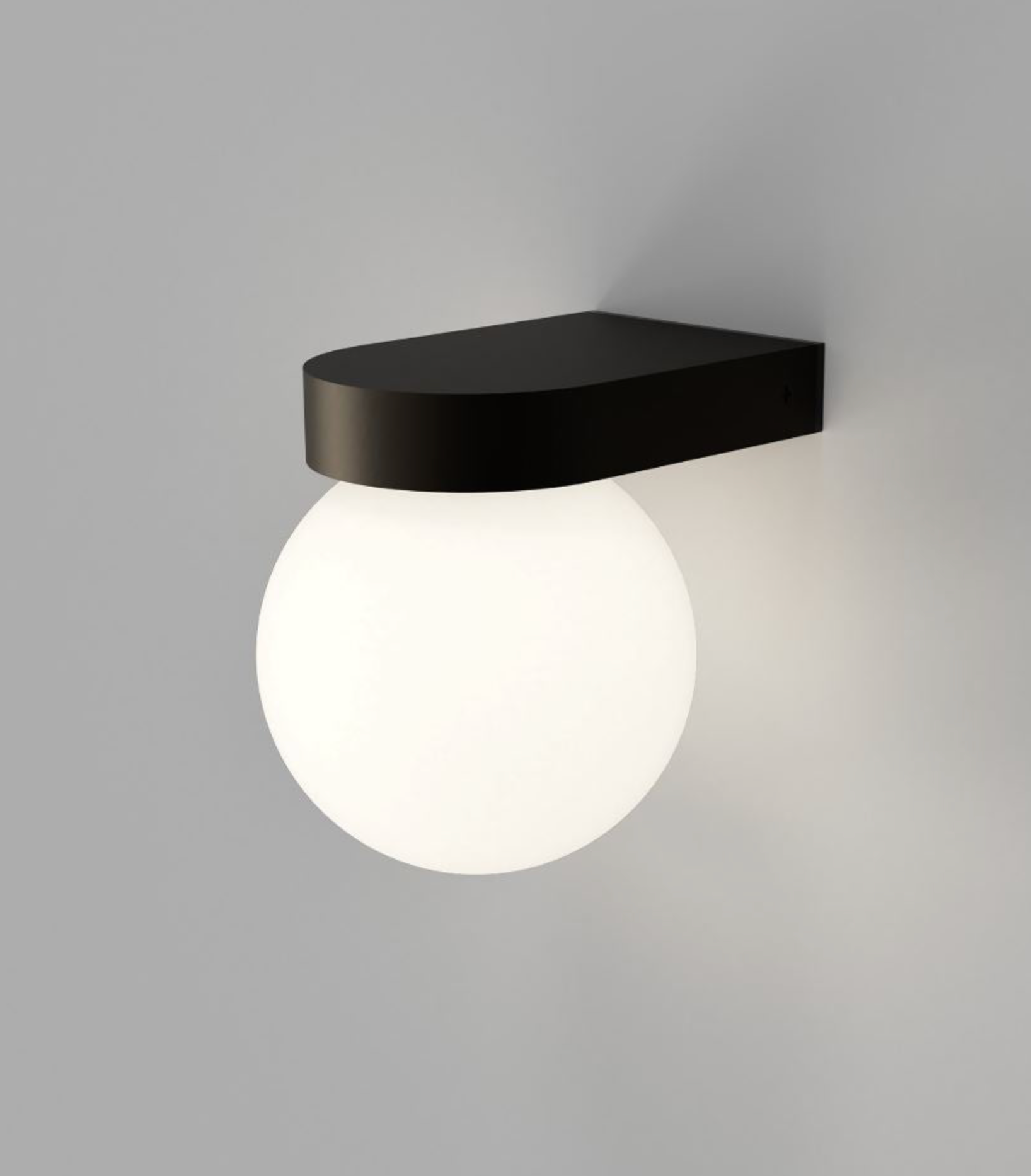 Wall-mounted outdoor light fixture with black bracket and white globe on a gray background