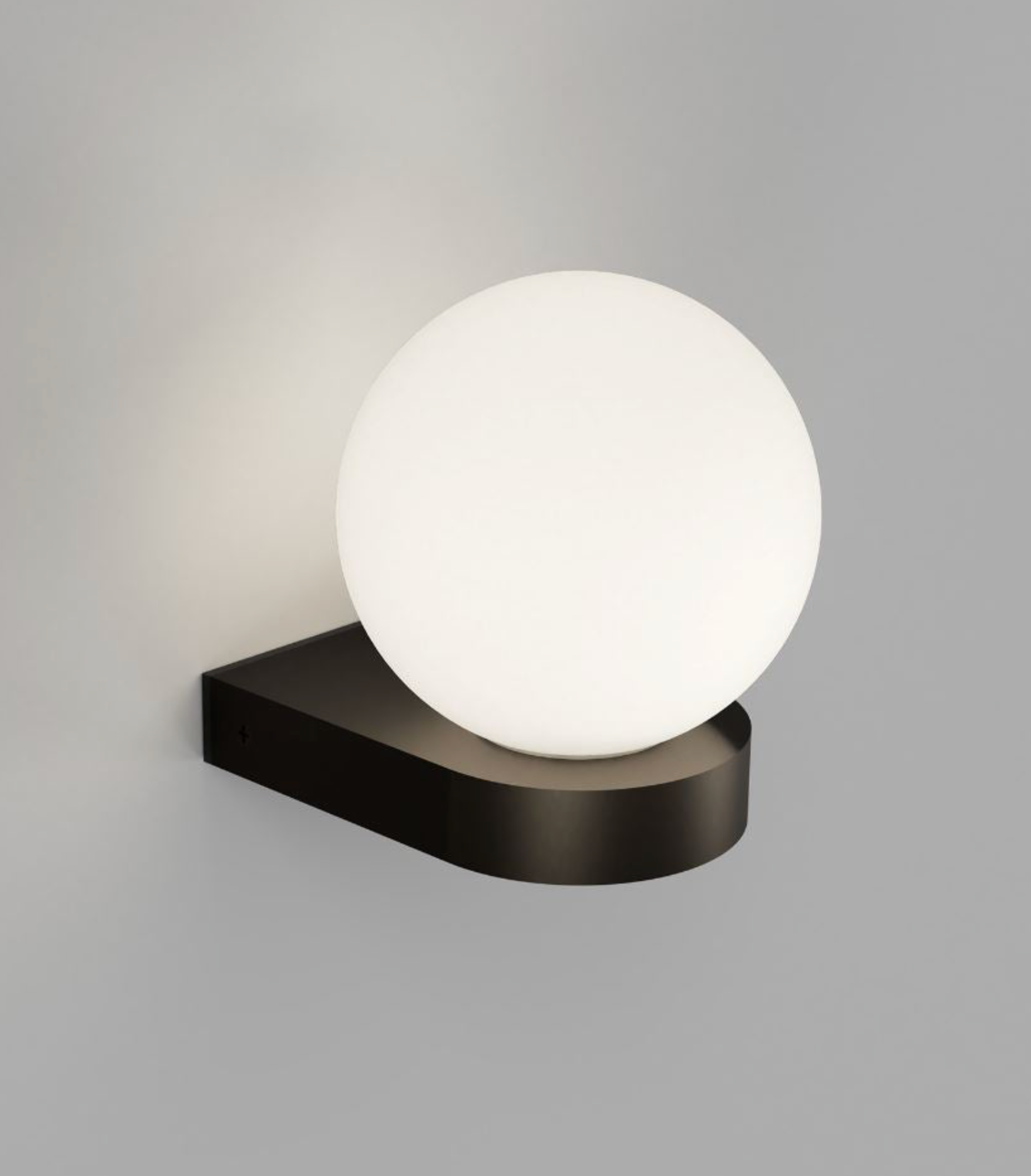 Wall-mounted outdoor light fixture with a white spherical lamp on a gray background