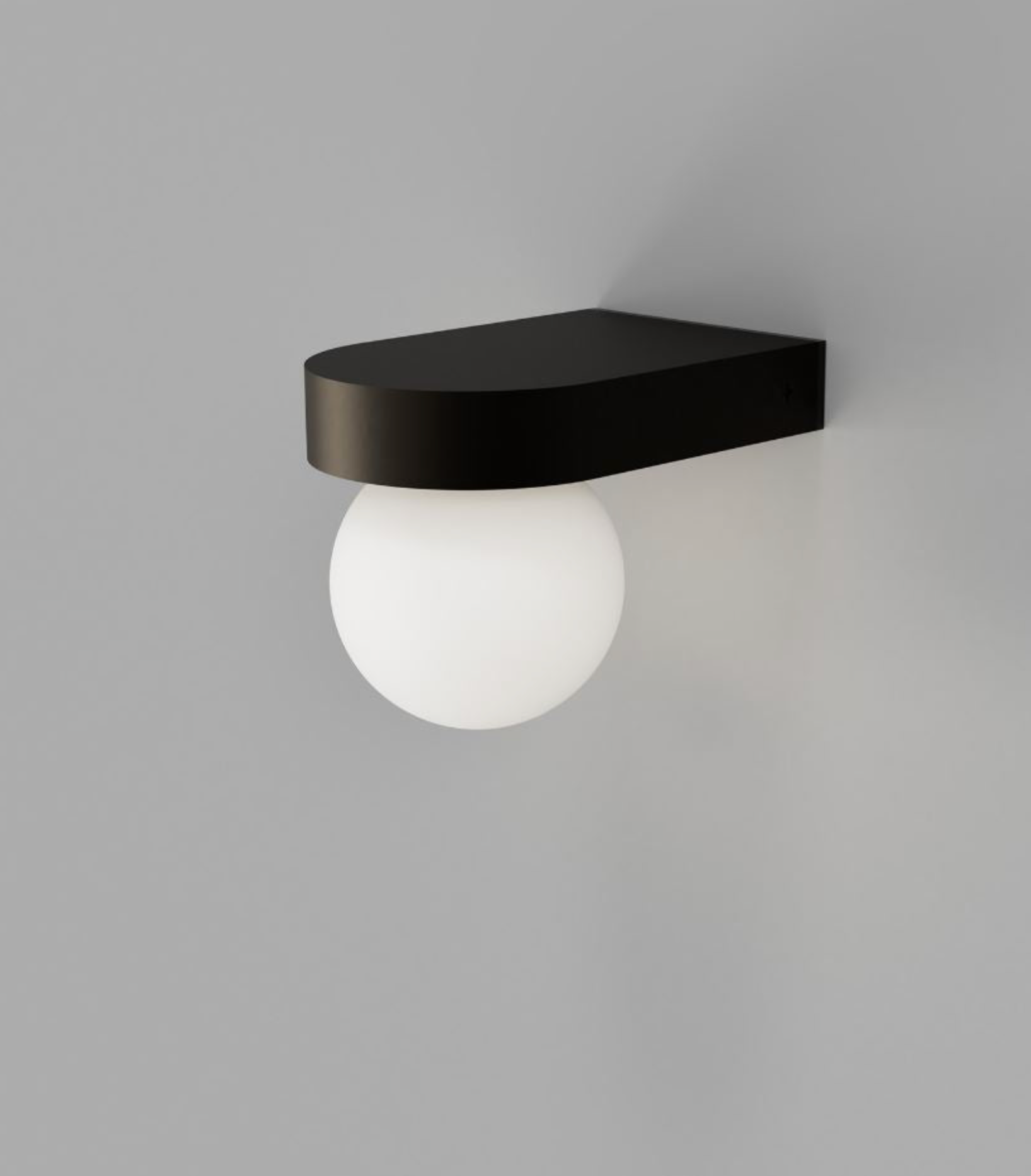Wall-mounted outdoor light fixture with a black shelf and white bulb on a grey background