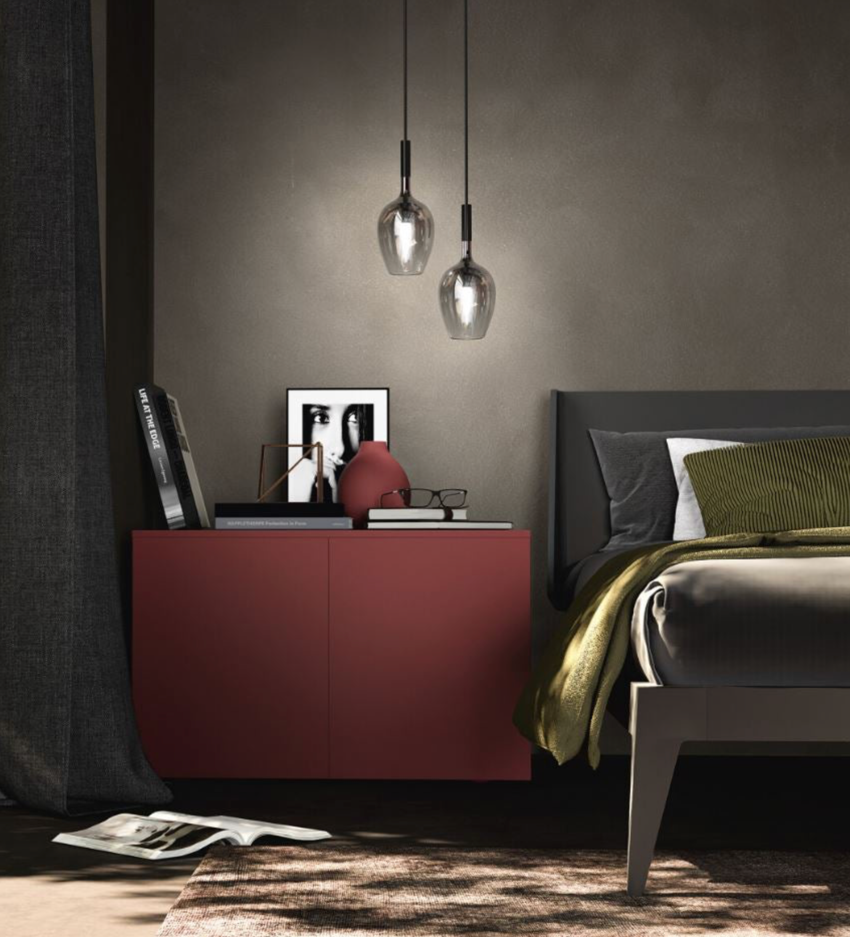 Modern bedroom with a red nightstand, bed, and hanging glass pendant lights.