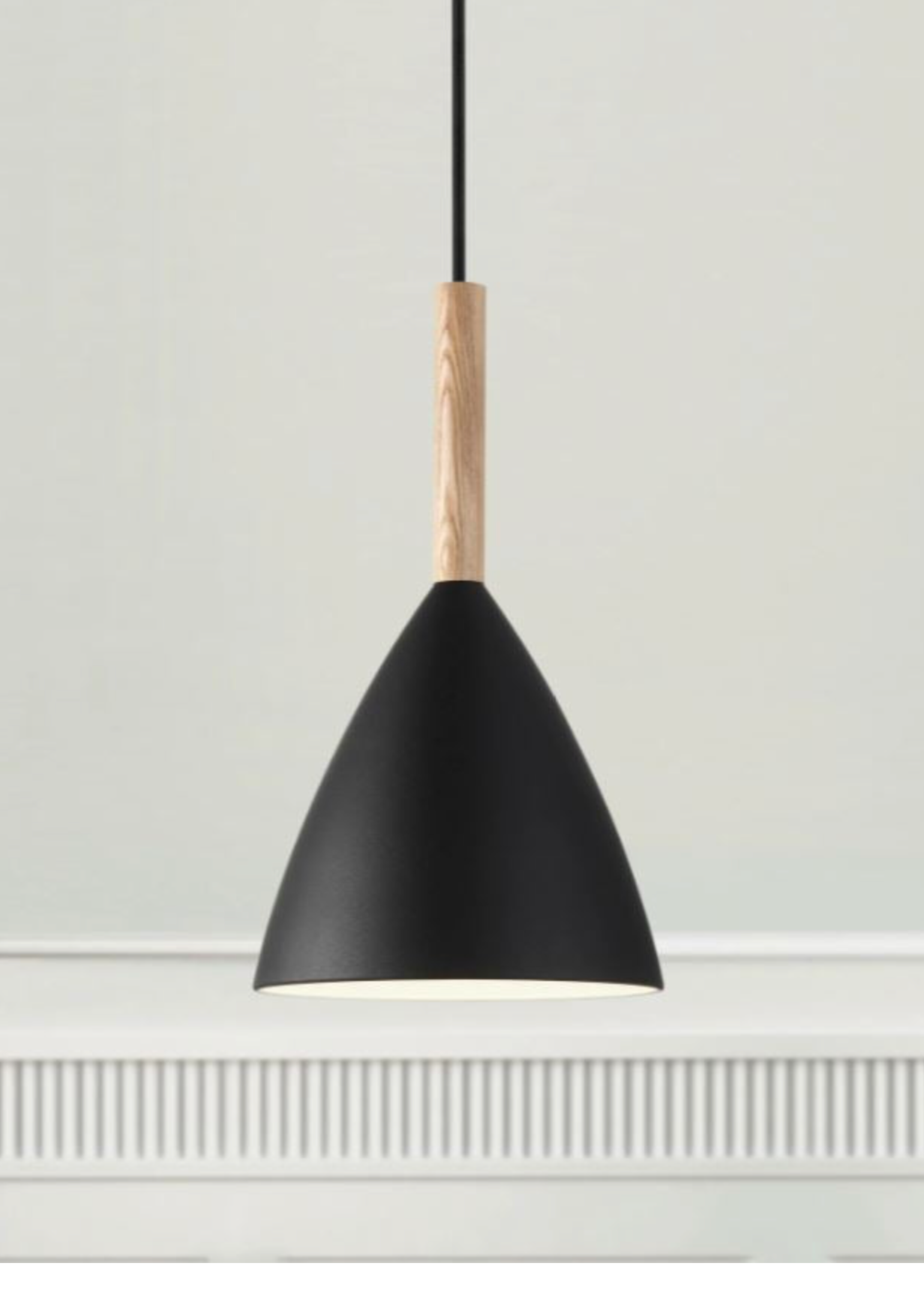 Black pendant light with wooden accent on a white wall