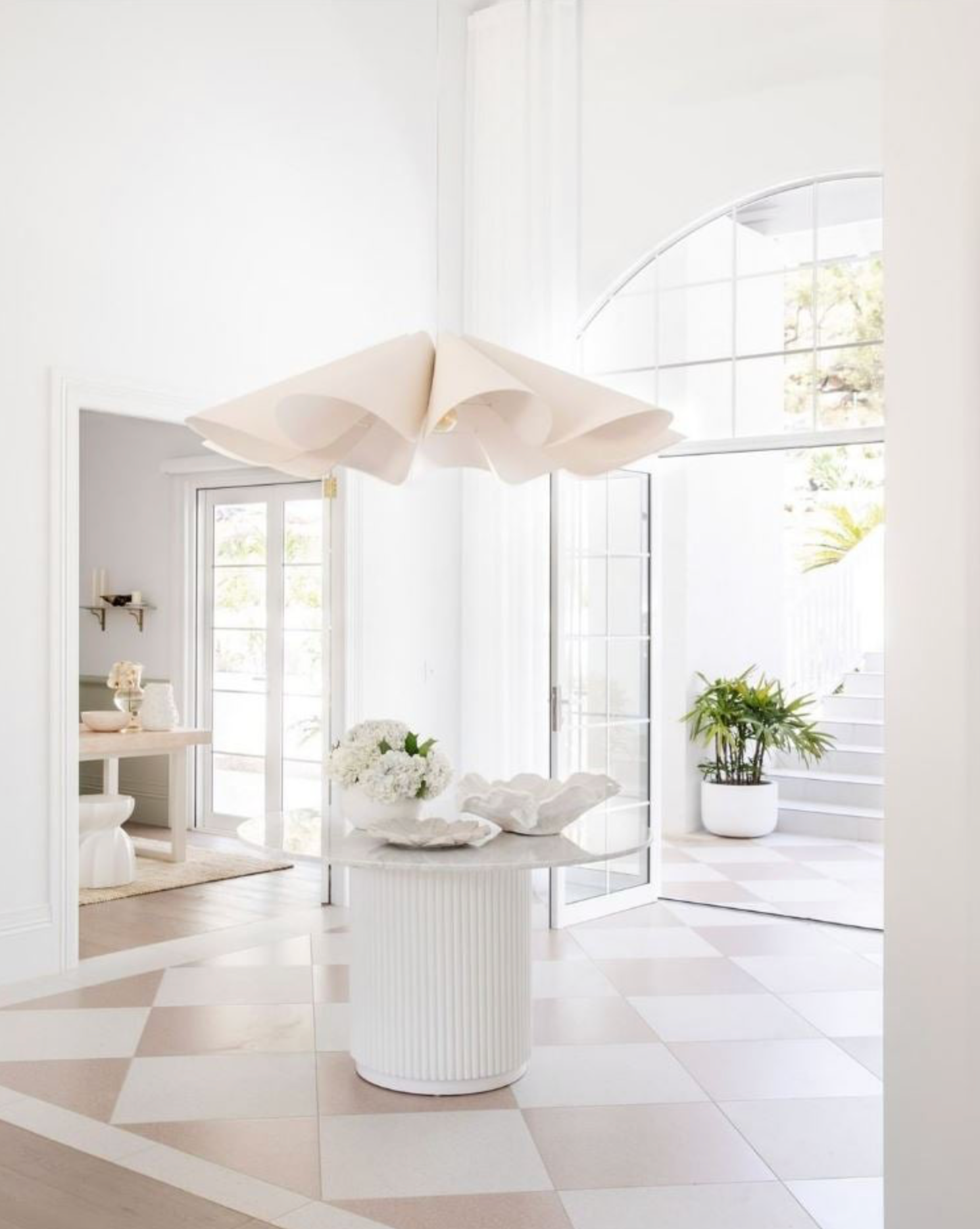 Modern interior with white furniture, feature pendant light and decor elements