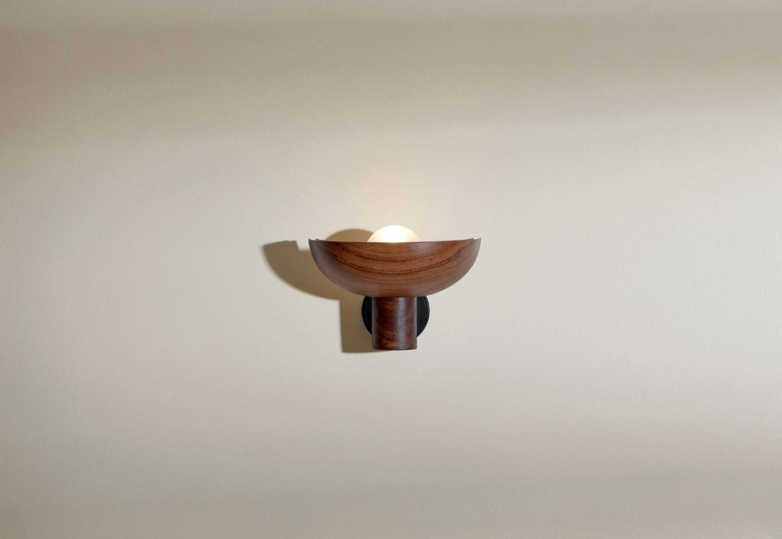 Wooden wall sconce on a plain wall
